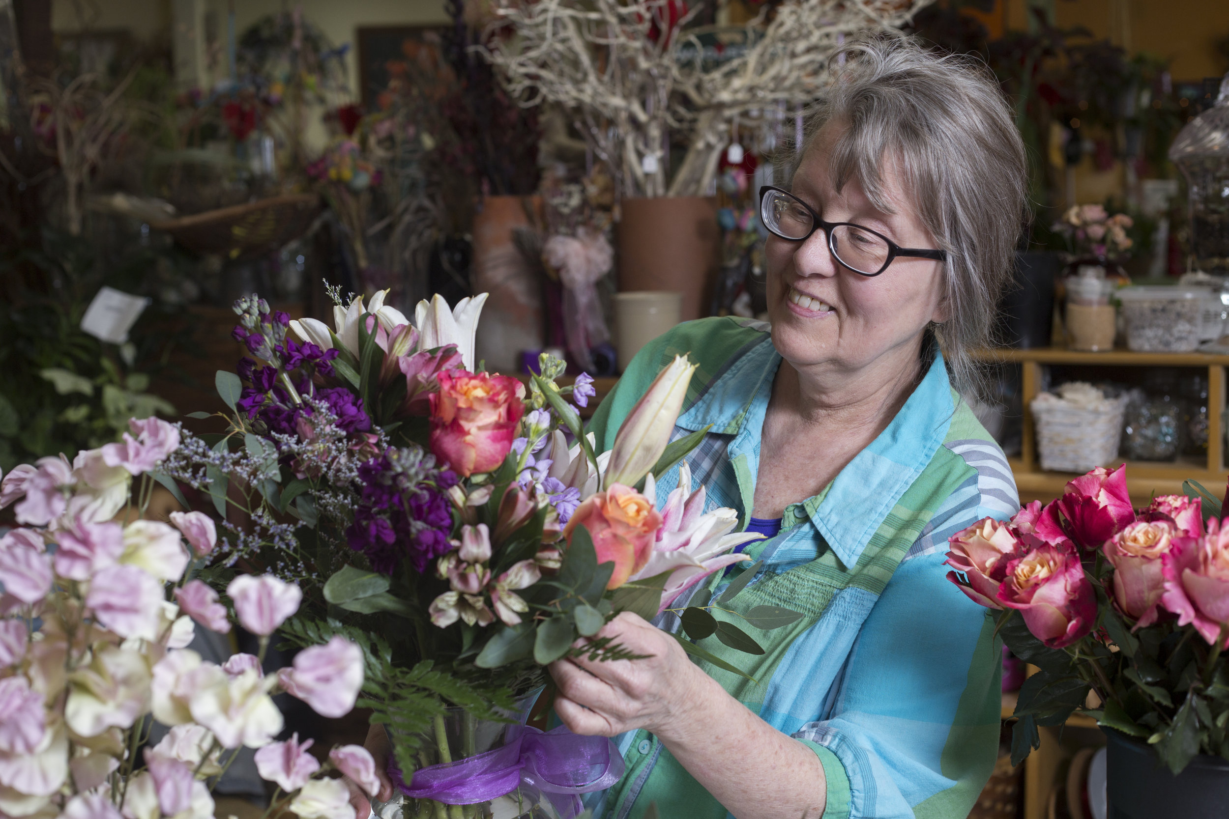  Polly Creech, the owner of Hyacinth Bean in Athens, Ohio, prepares a bouquet in her flower shop on February 11, 2017. Creech said Hyacinth Bean's busiest time of the year is around Valentine's Day, with many orders coming in online. 