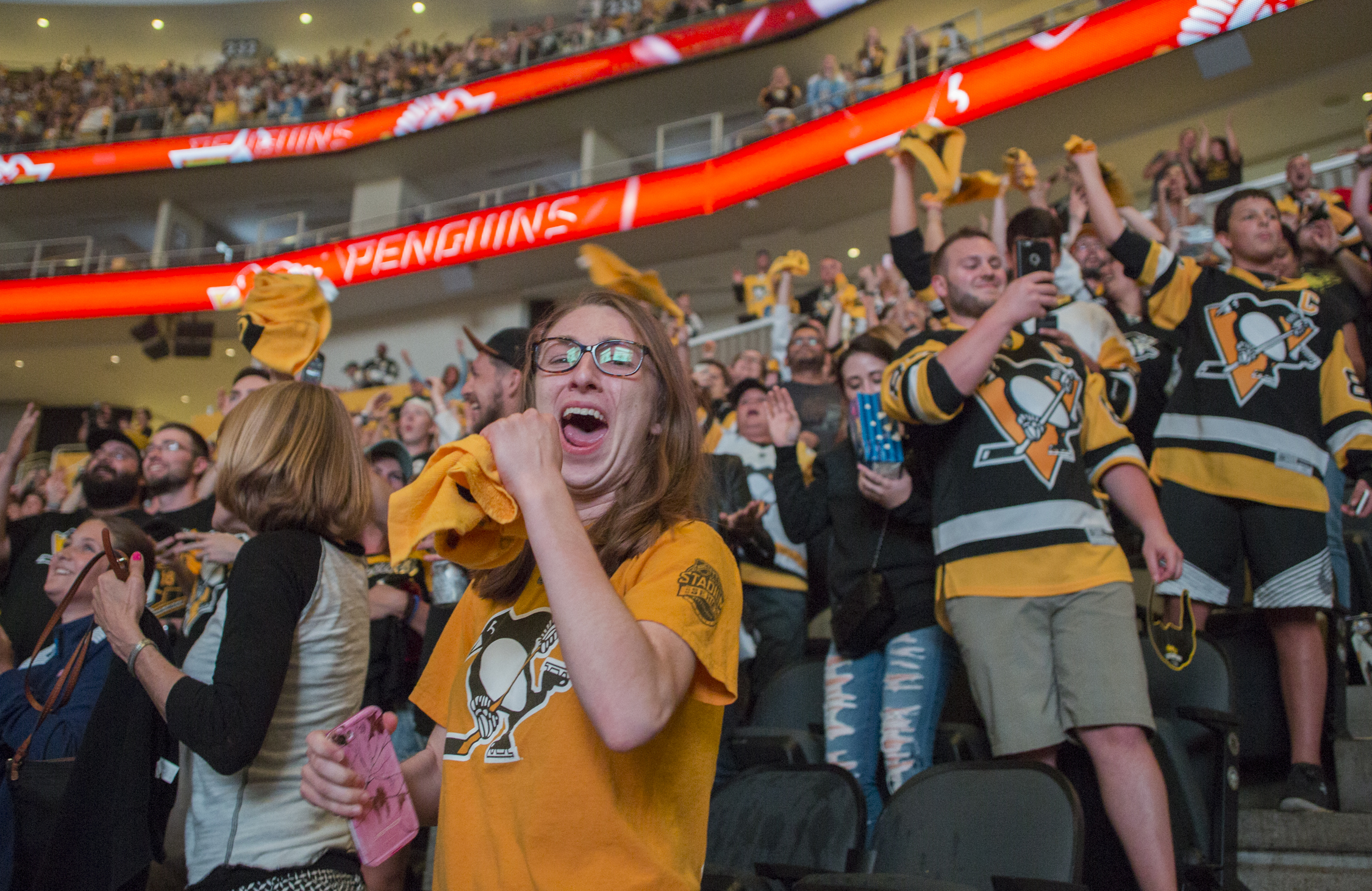  Erin Burke, of Ohio Township, Pa., cheers as the Penguins score their first goal in the third period of the sixth game of the Stanley Cup Championship during a watch party in PPG Paints Arena in Pittsburgh, Pa. on June 11, 2017. The Penguins won the