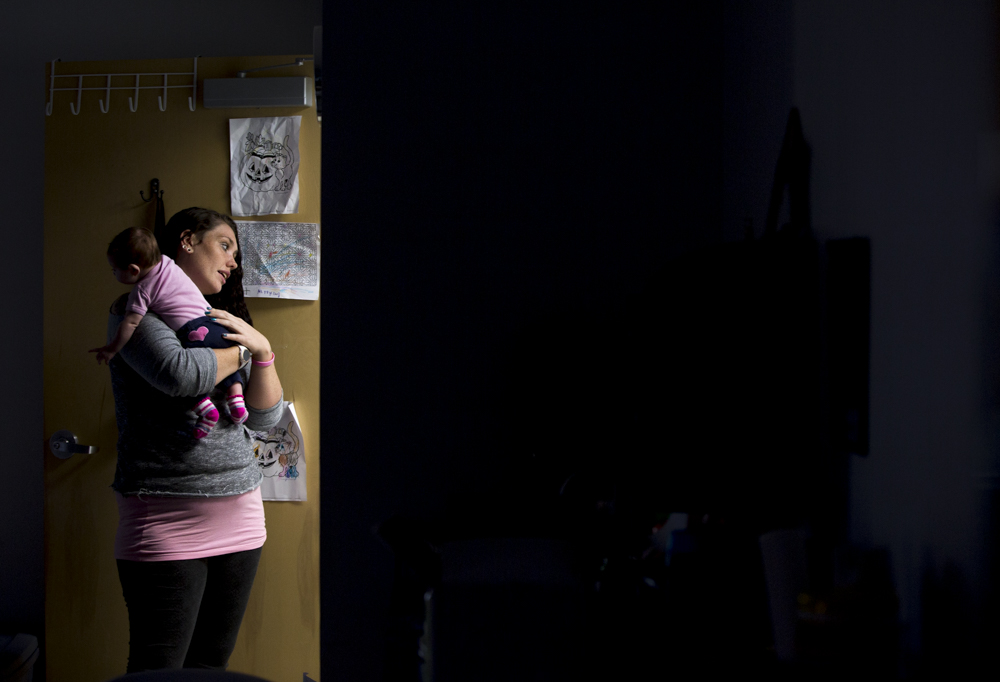  Vanessa holds her daughter at the Stepping Stones Treatment Facility in Portsmouth, Ohio. Vanessa, who was going through her eighth attempt at treatment for drug addiction, is determined to stay clean and regain full custody of her three children. 