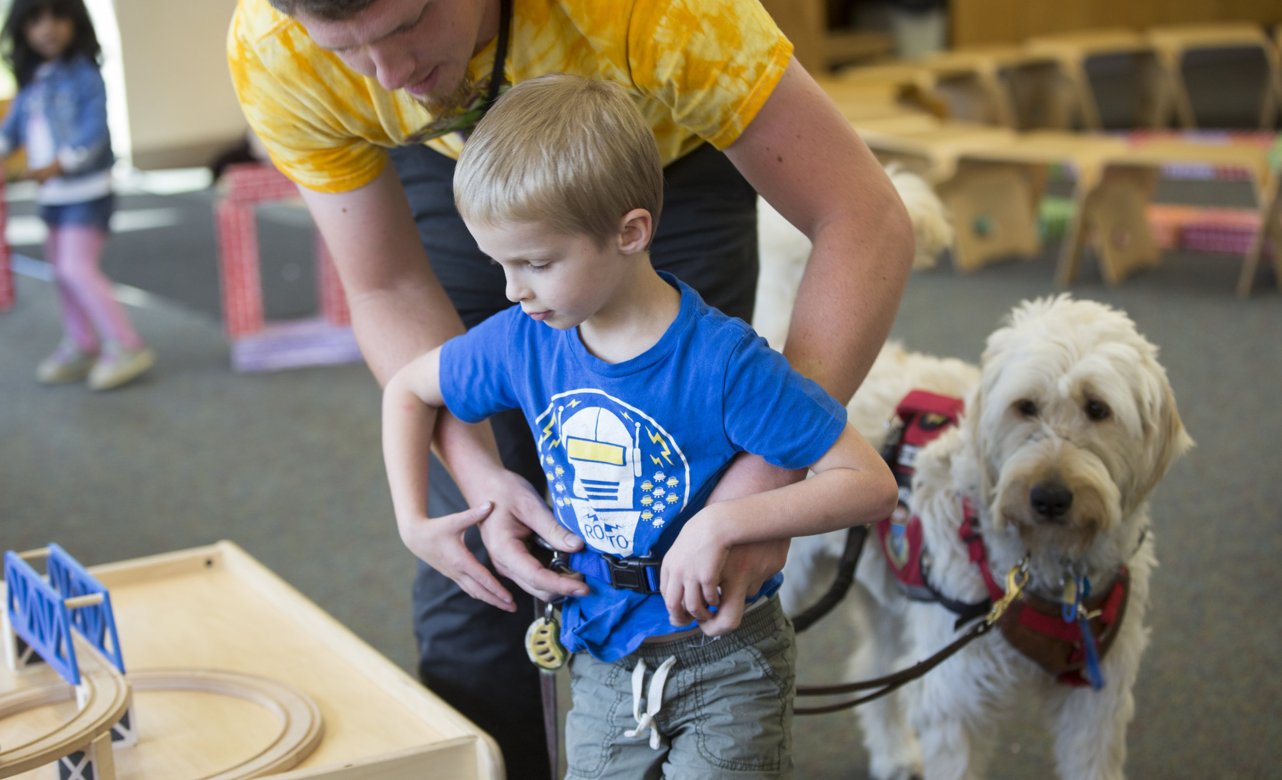  Jason, Josiah's father, attaches a tether around Josiah that physically connects him to Spad. They are usually tethered when they are in public and when Josiah is having trouble focusing in school. The tether prevents Josiah from running away from h