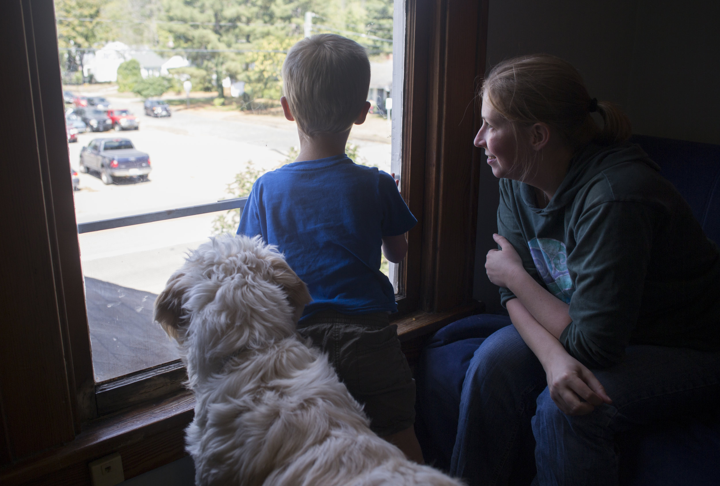  Spad, Josiah, and Rachel look out the playroom window in their home in Athens, Ohio. Rachel said she believes Josiah and Spad's relationship will strengthen with time and has hope that Spad will help Josiah get through every-day challenges. "It's no