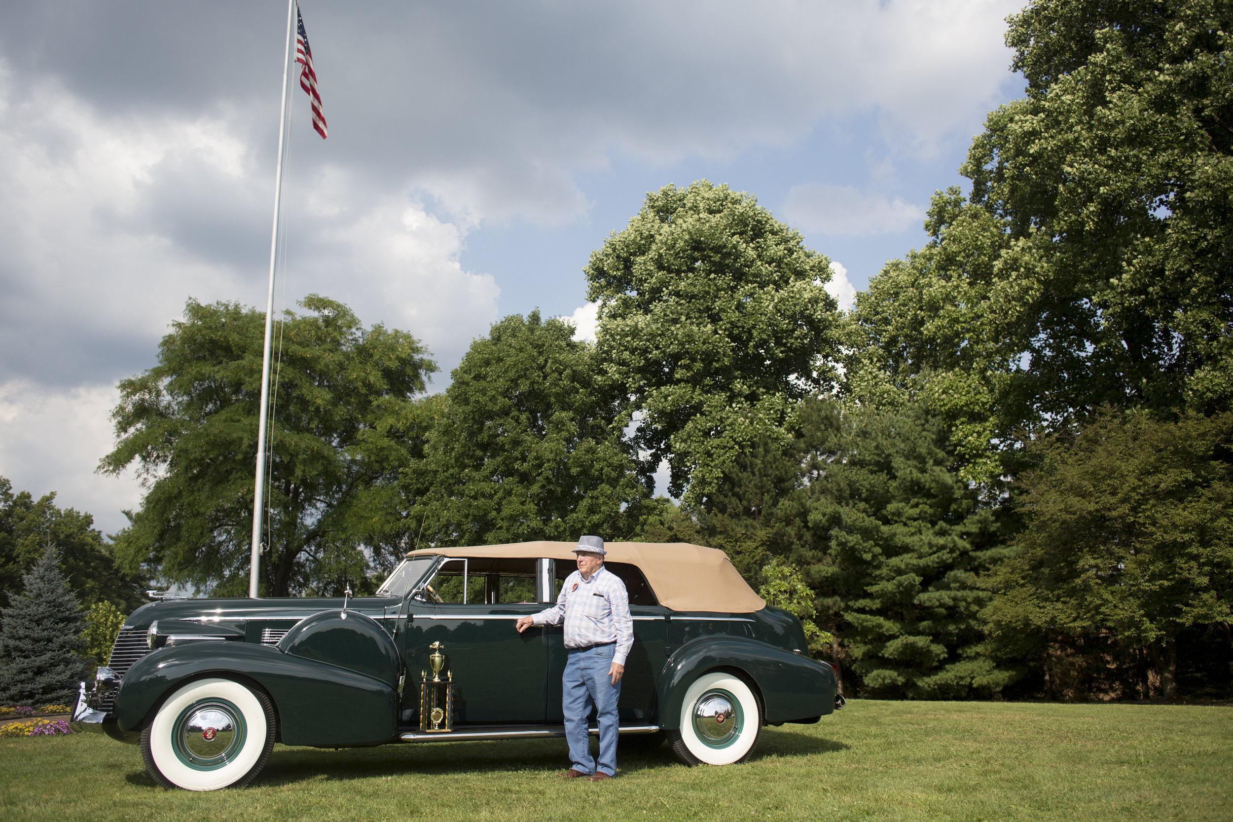  Fred Wicker, of Canfield, Ohio, poses with his 1940 Cadillac after winning Best of Show for authentic vehicles at the Cars in the Park fundraiser car show in Boardman Park on Sunday, Aug. 5, 2018. 