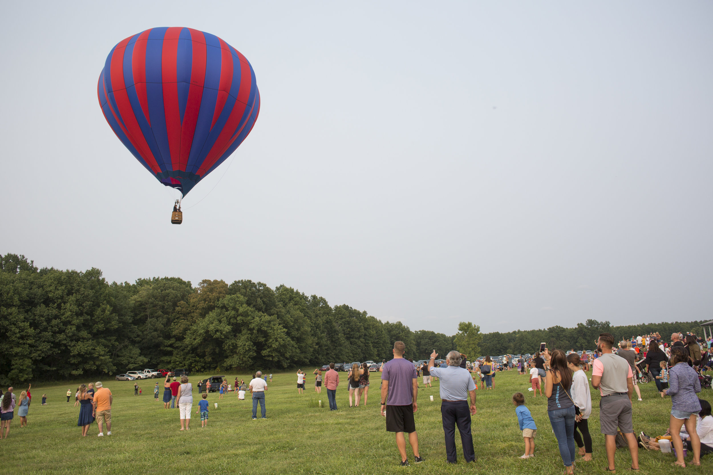  People watch as a hot air balloon takes flight at the Hot Air Balloon Festival at Mastropietro Winery in Berlin Center, Ohio on Sunday, Aug. 19, 2018. 