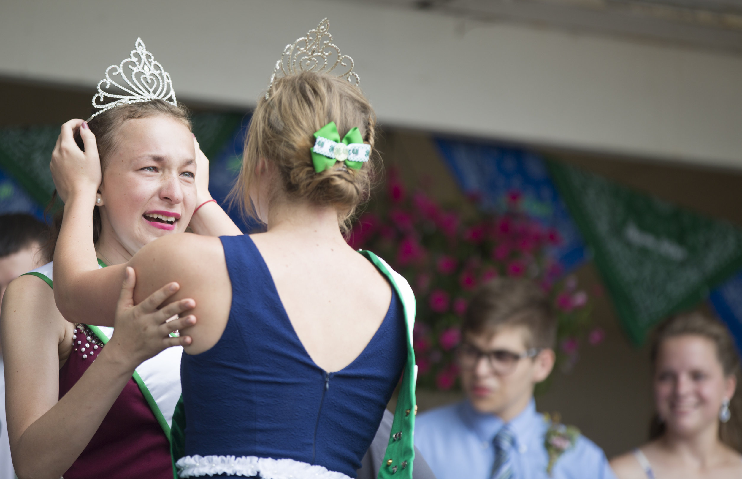  Callia Barwick, left, 16, of Canfield, Ohio, gets crowned the 2018 4-H queen by Tiffany Voland, of North Jackson, Ohio, the 2017 4-H queen, during the 4-H King and Queen coronation at the Canfield Fair's Youth Day Ceremony on Thursday, Aug. 30, 2018