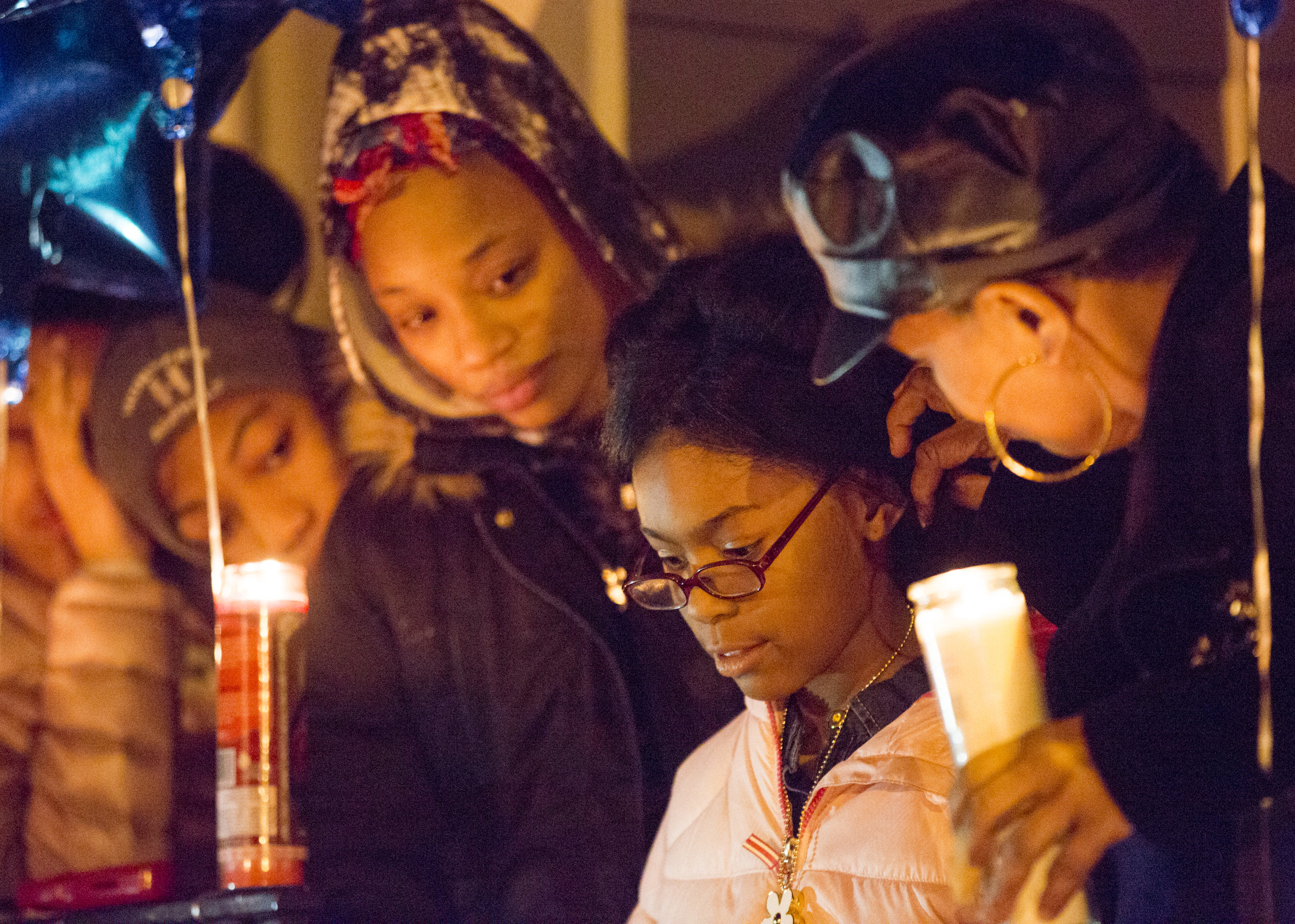  Jayla Burroughs, 8, the daughter of Matthew Burroughs, talks about how much she’ll miss her father during a vigil held in his honor outside of his apartment in Niles, Ohio on Jan. 5, 2019. Matthew Burroughs was shot and killed a few days earlier by 