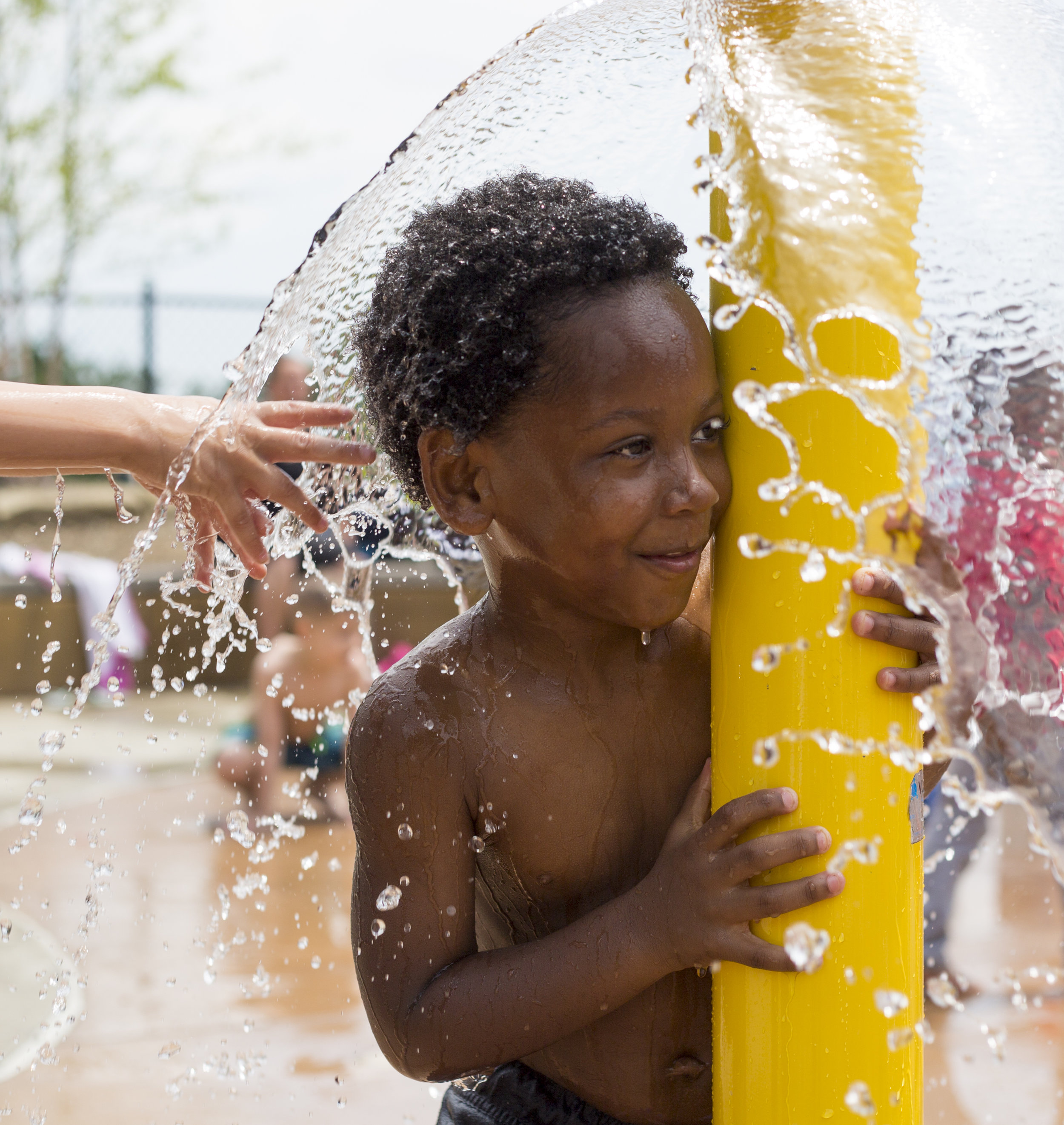  Mason Moore, 6, who attends Daycare Storybook in Youngstown, Ohio, plays under the water with other kids at the water park in the James L. Wick, Jr. Recreation Area in Mill Creek Park in Youngstown, Ohio, on June 27, 2019. The daycare took their kid