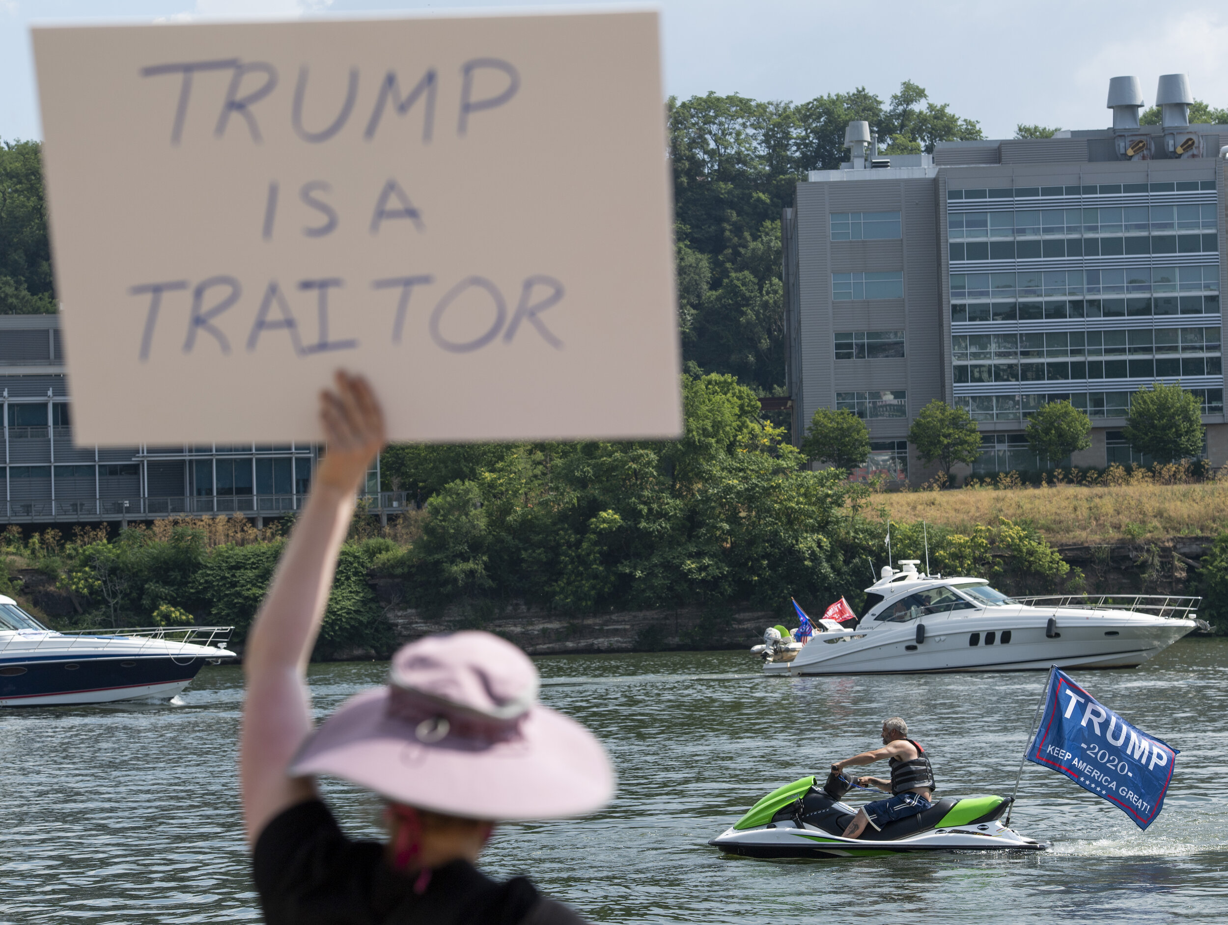 Participants of the 4th of July Trump Team PA Boat Parade and MAGA Rally get their boats ready while others protest the event on Saturday, July 4, 2020, near the Hot Metal Bridge on the South Side of Pittsburgh.  