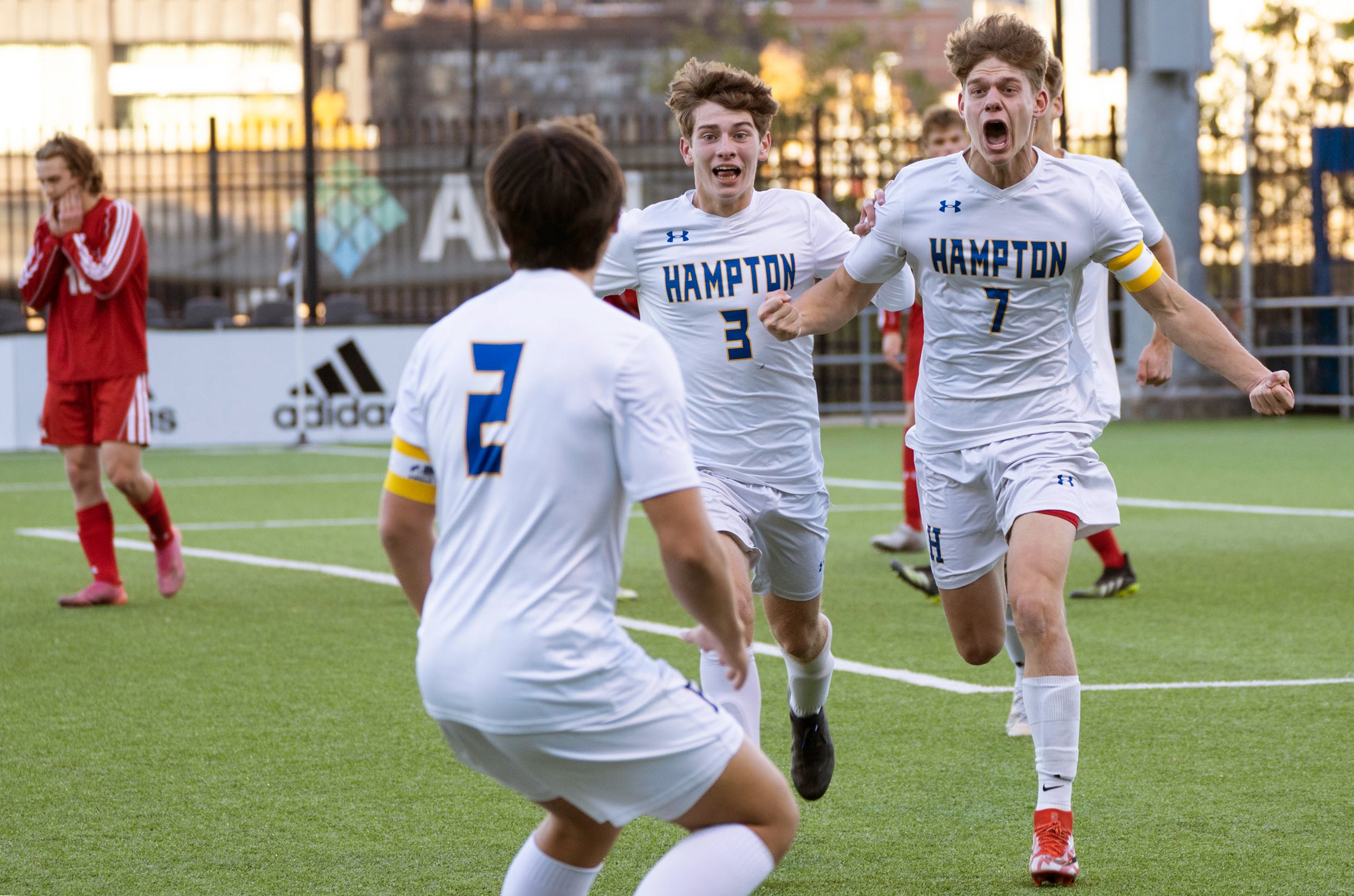  Hampton’s Zach Panza, right, celebrates with his team after scoring a goal during the 3A championship on Saturday, Nov. 6, 2021, at Highmark Stadium on the South Side of Pittsburgh. Hampton won 1-0. (Emily Matthews/Post-Gazette) 