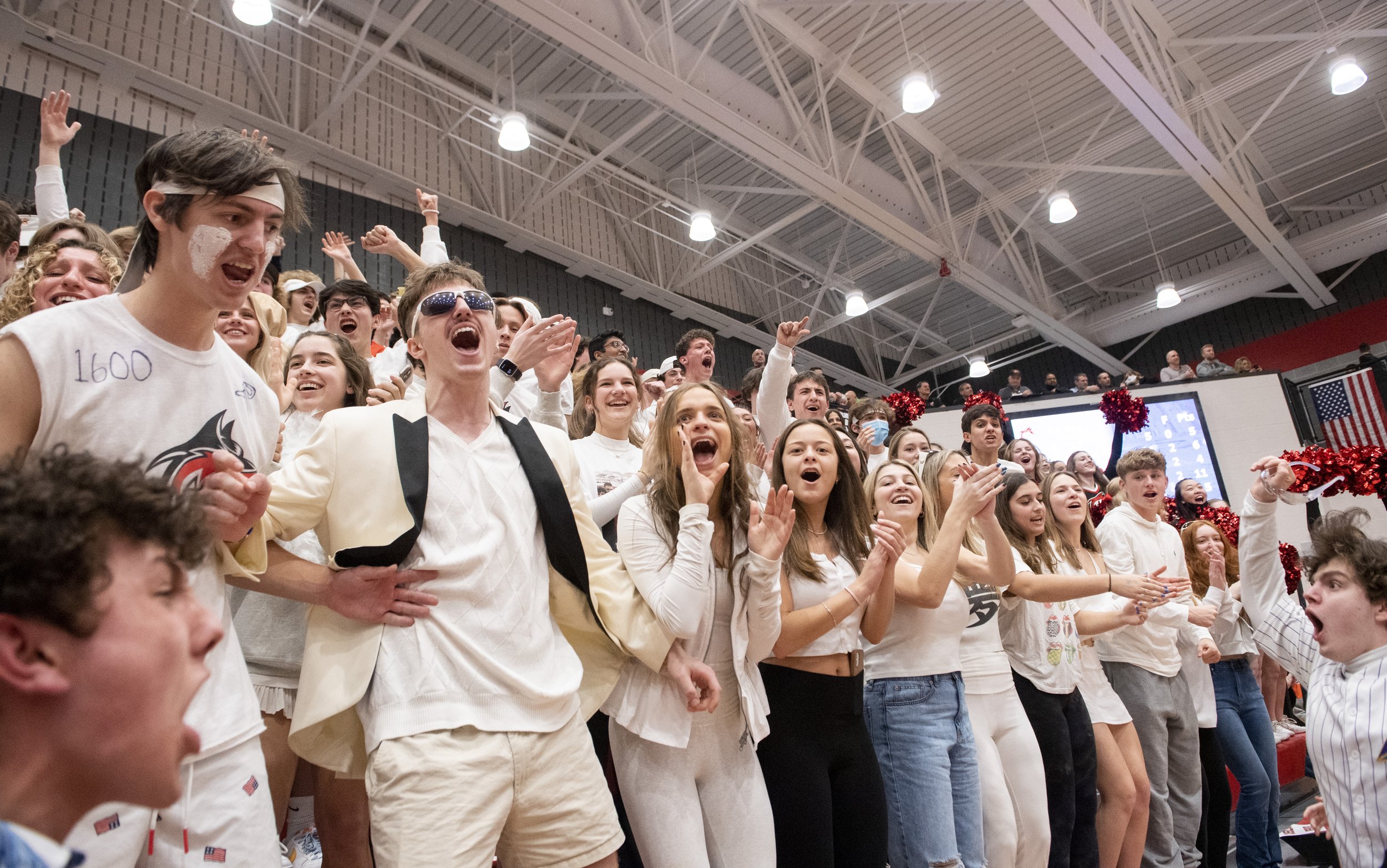  Fox Chapel High School’s student section celebrates their boys basketball team’s 37-32 victory against Central Catholic High School on Tuesday, March 1, 2022, at Peters Township High School. (Emily Matthews/Post-Gazette)  