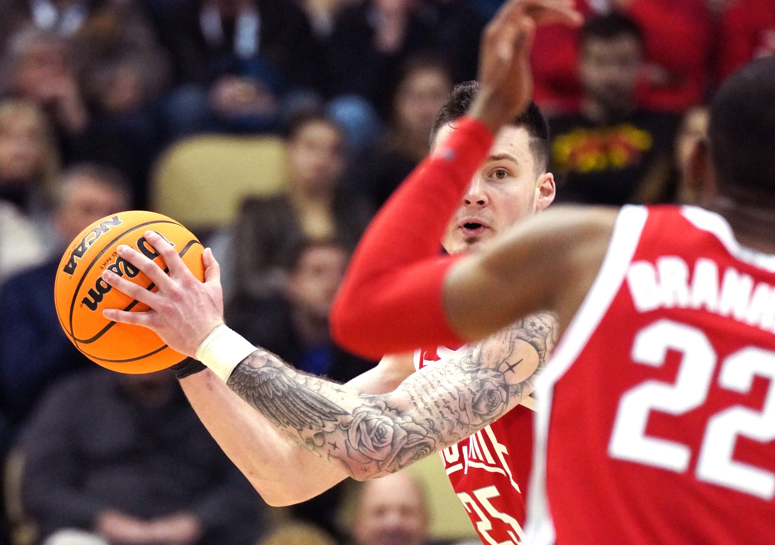  Ohio State’s Kyle Young looks to pass the ball against Villanova during the second round of the 2022 NCAA Men's Basketball Tournament on Sunday, March 20, 2022, at Pittsburgh’s PPG Paints Arena. Villanova won 71-61. (Emily Matthews/Post-Gazette)  