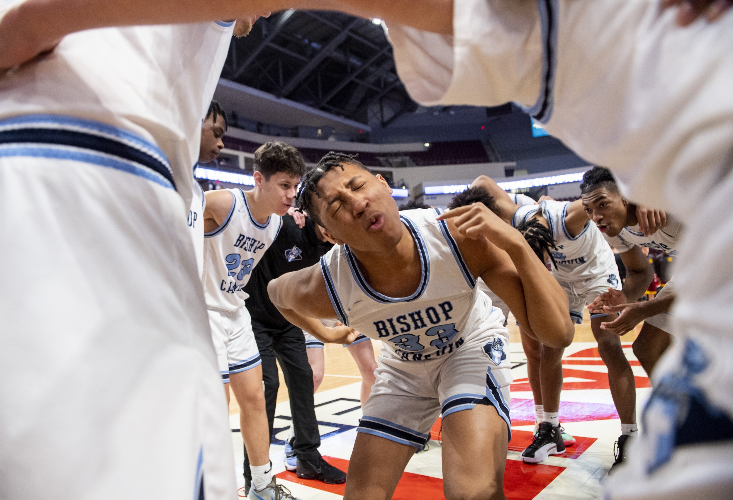 Bishop Canevin’s Ngai Avery, center, celebrates with his team after their 64-47 victory against St. John Neumann in the PIAA class 1A boys basketball championship on Thursday, March 24, 2022, at Giant Center in Hershey, Pa. (Emily Matthews/Post-Gaze