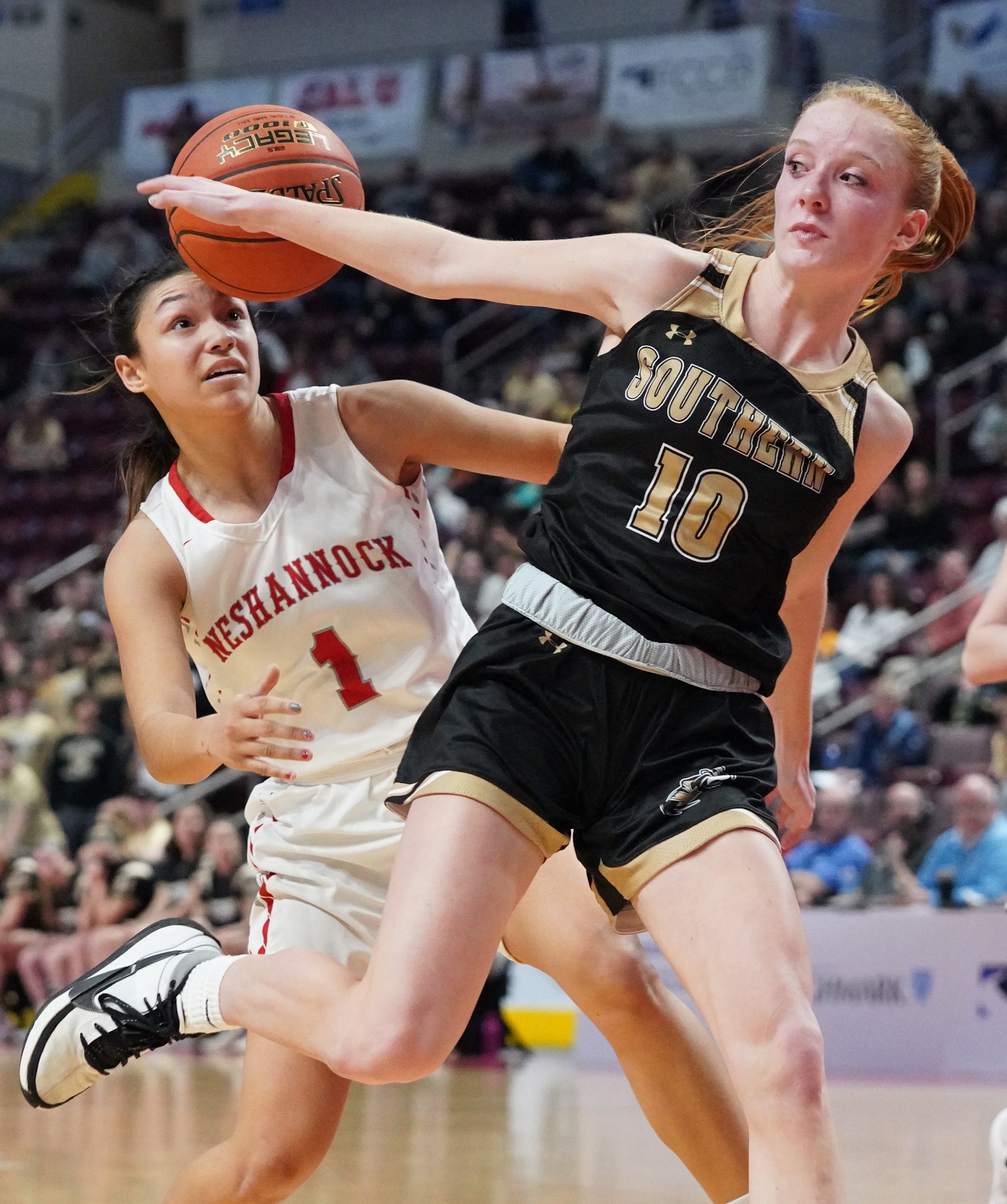  Neshannock’s Neleh Nogay keeps her eye on the ball as she loses control of it against Southern Columbia’s Cassidy Savitski in the PIAA 2A girls basketball championship on Friday, March 25, 2022, at Giant Center in Hershey, Pa. Neshannock won 62-56. 