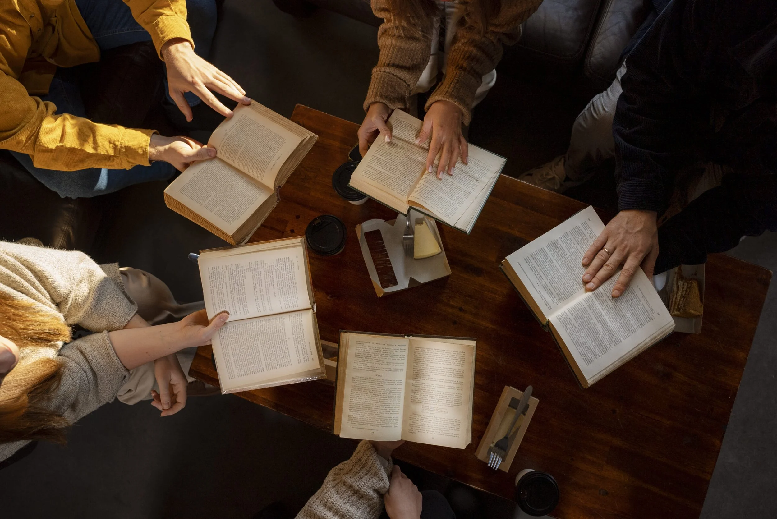 top-view-people-reading-together-1-scaled.jpg