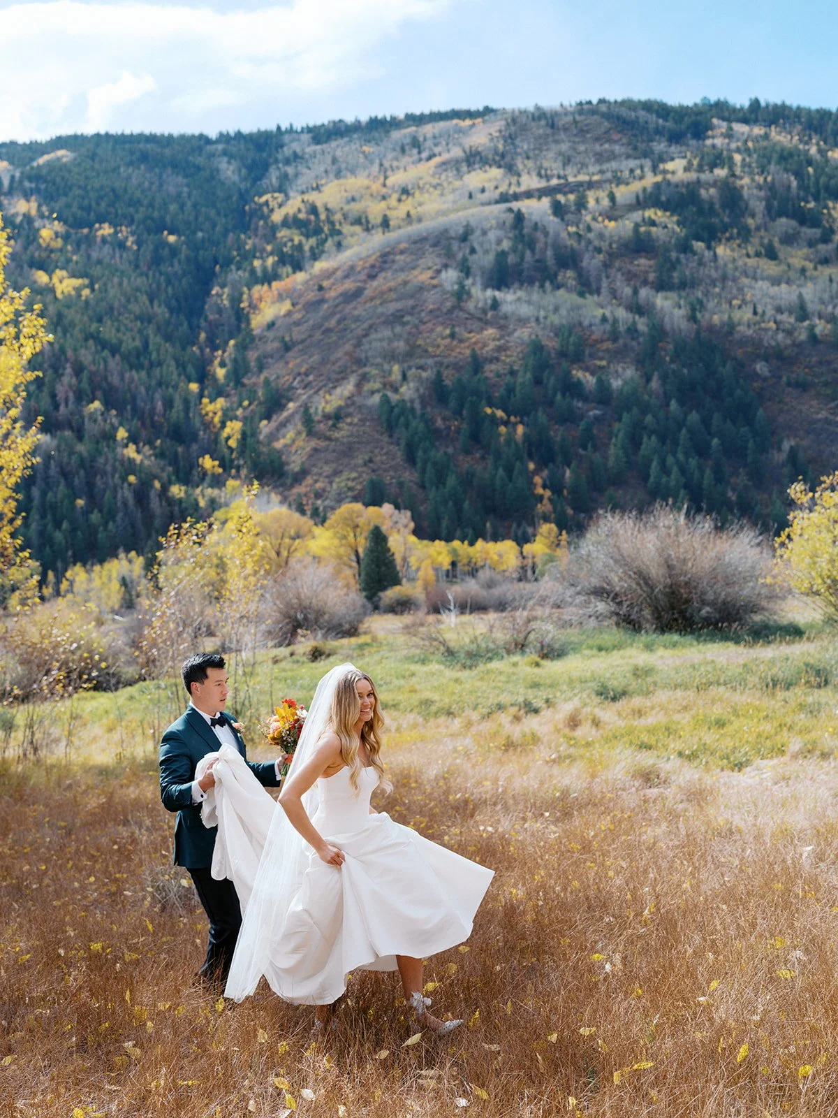 Bride and groom portraits surrounded by autumn aspens