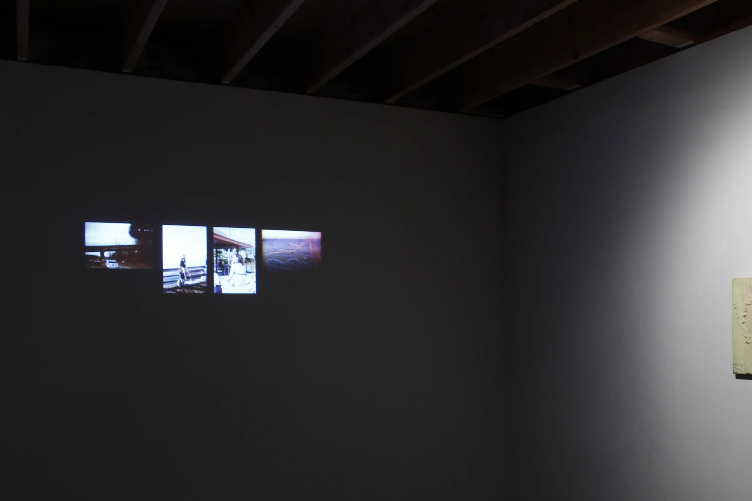 Installation view, Unemployed, 2005-2015, slideshow on single channel projection