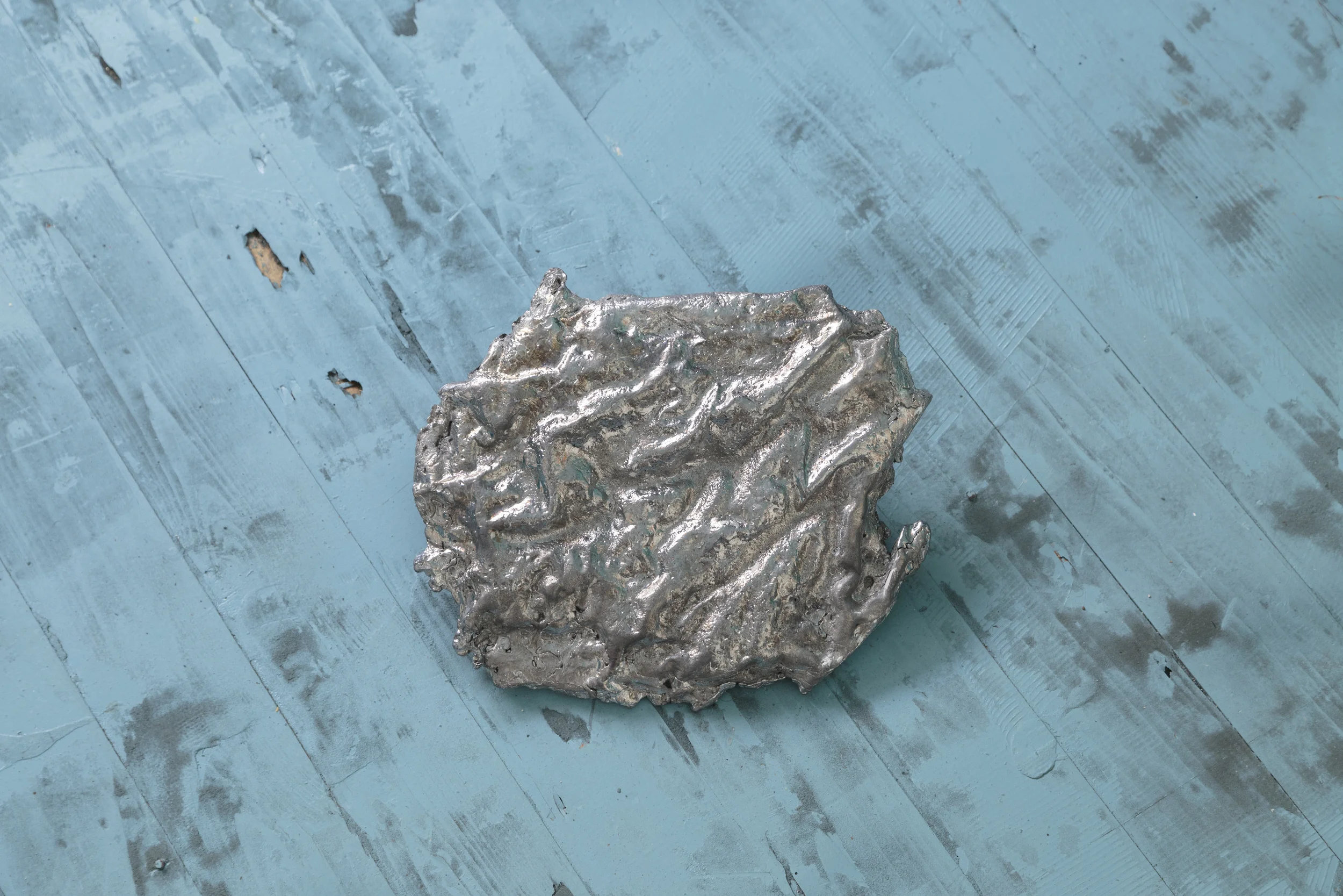 Installation view at Artist-Run Satellite Miami, We step into the same river twice, 2015, lead Cast from a wax impression of a surface of water in Groningen, Netherlands