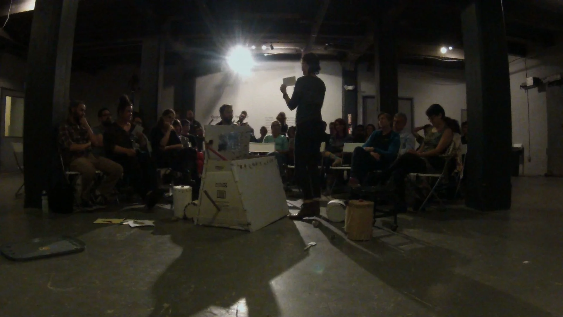 Still for documentation of M-OSRISC, First Model Demonstration (The Manually-Operated Somewhat Random Image Selection Container) Live demonstration performance, 2014