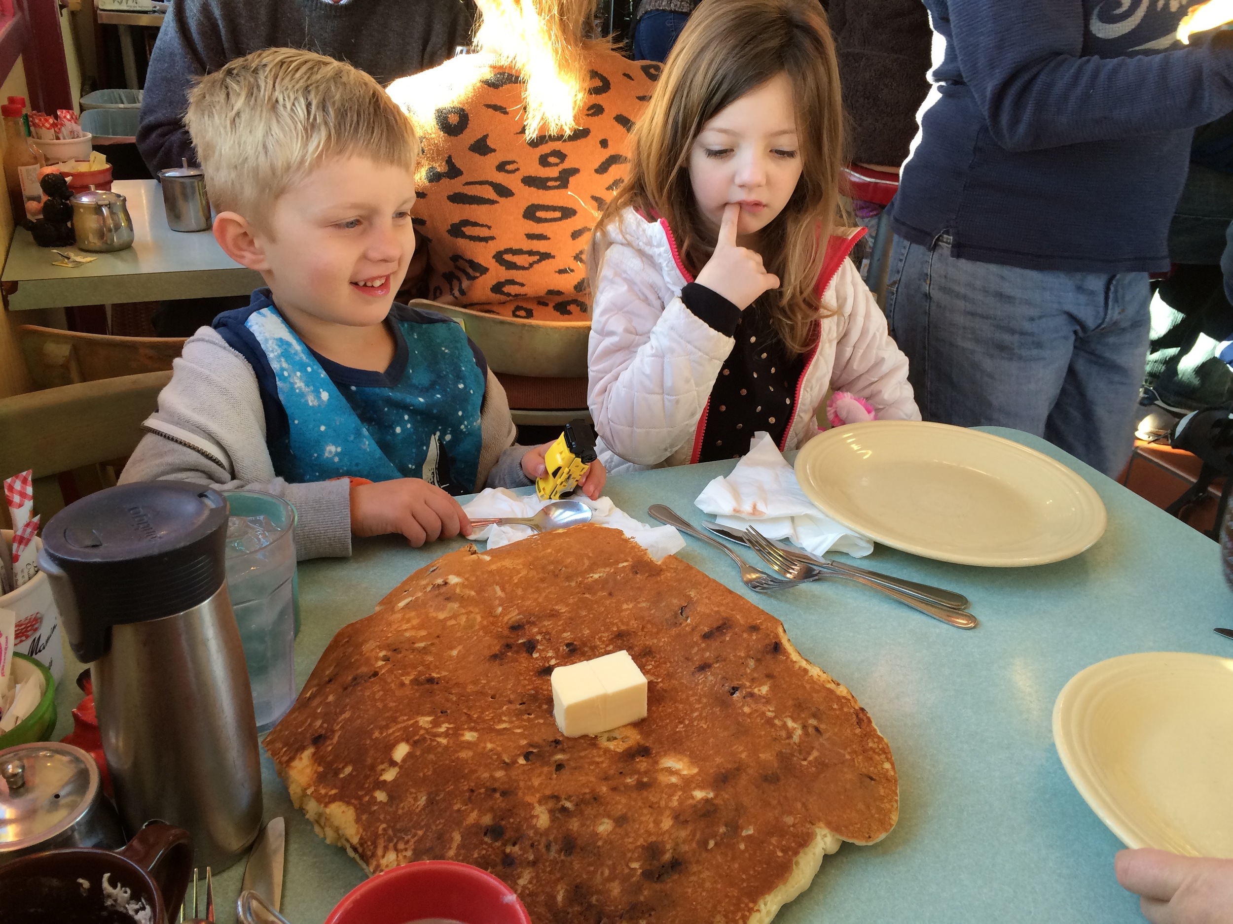 Evie eyes the pancake with worry.