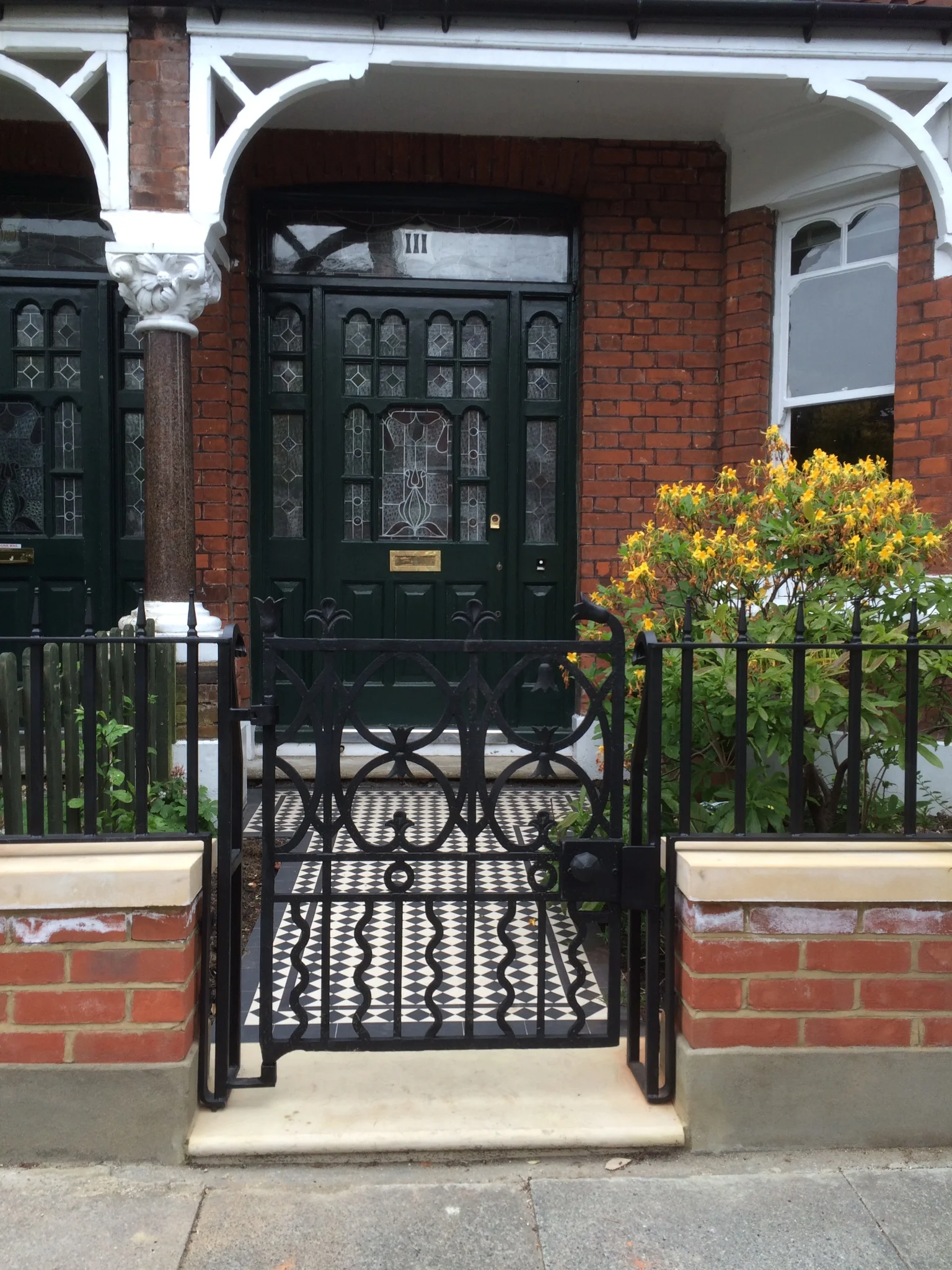  detail of the original cast iron post office gate 