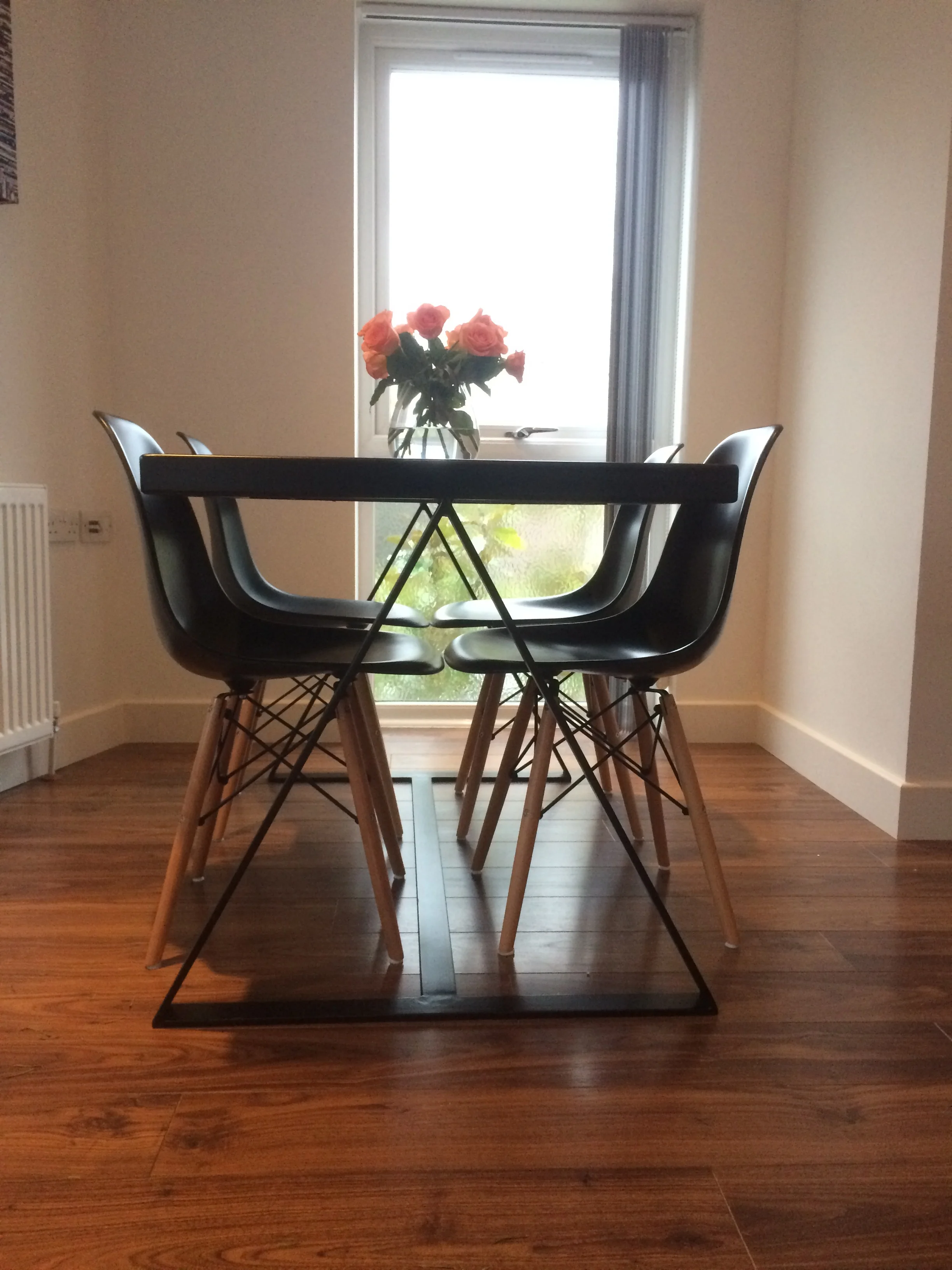  Mid century modern dining room table with reclaimed oak top boards. 