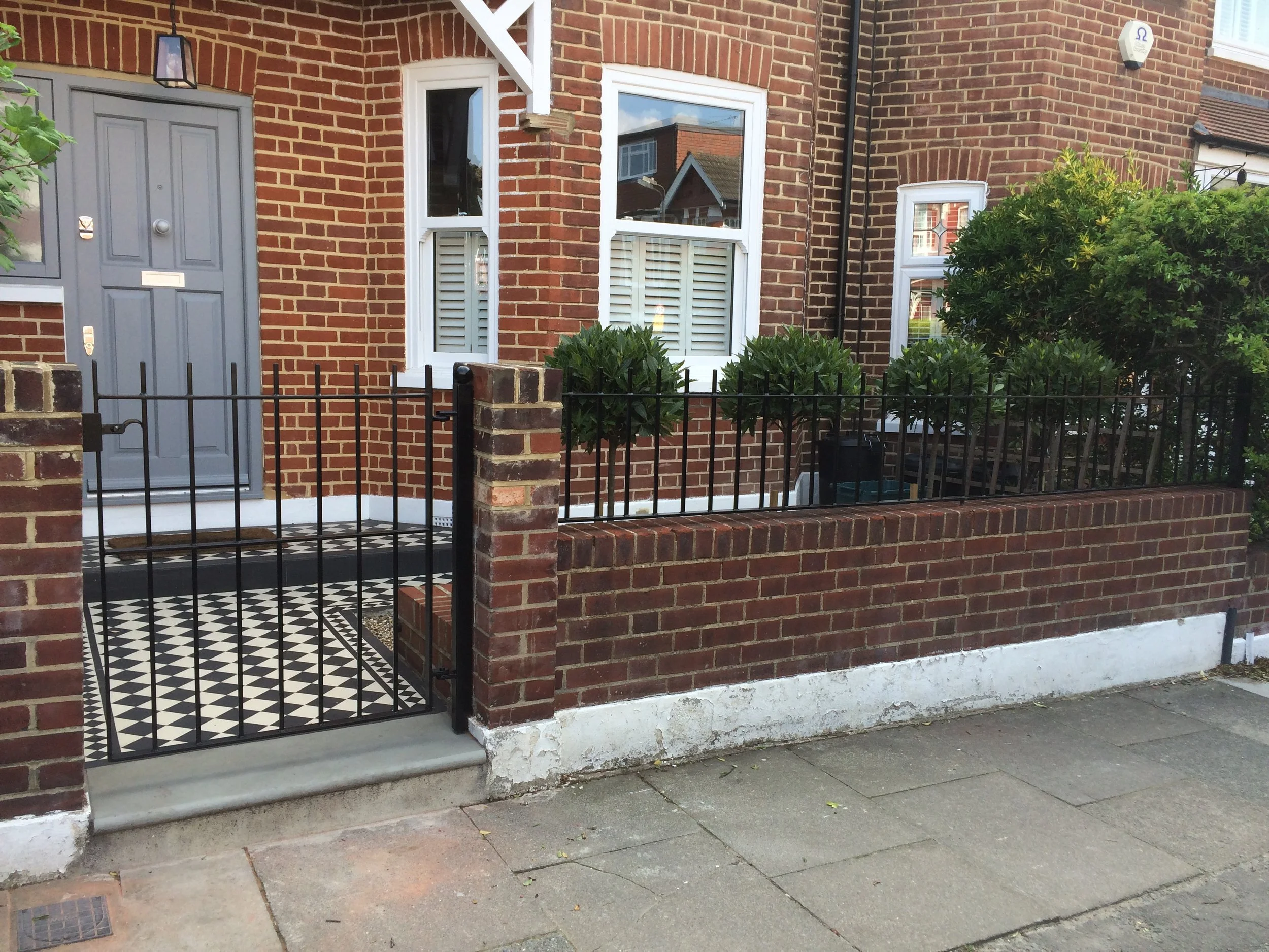  clean and simple gate and railings on Melrose Avenue in Wimbledon Park 