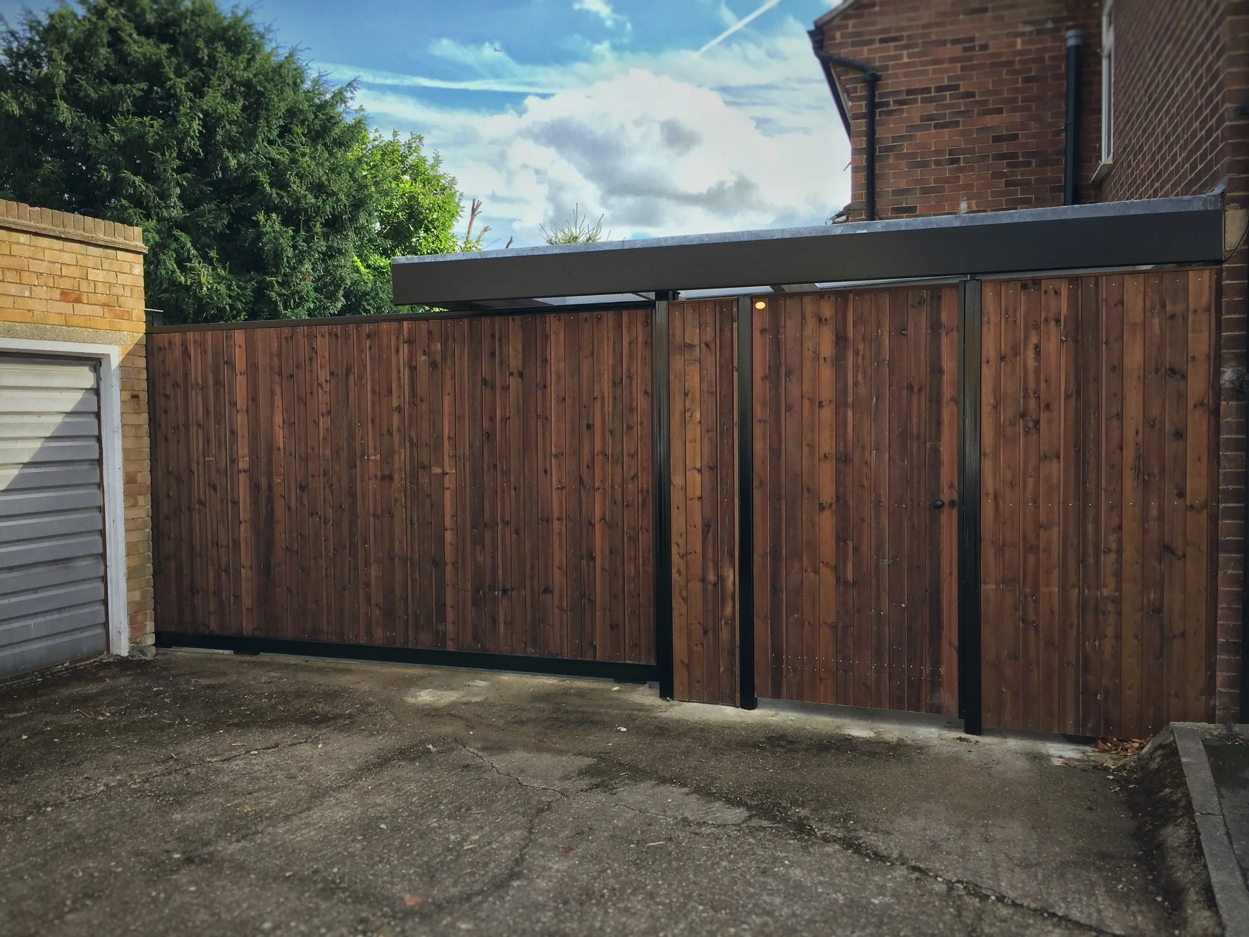 metal and wood sliding gate automation with infill panels and flush side gate-&nbsp;super clean and modern looking 