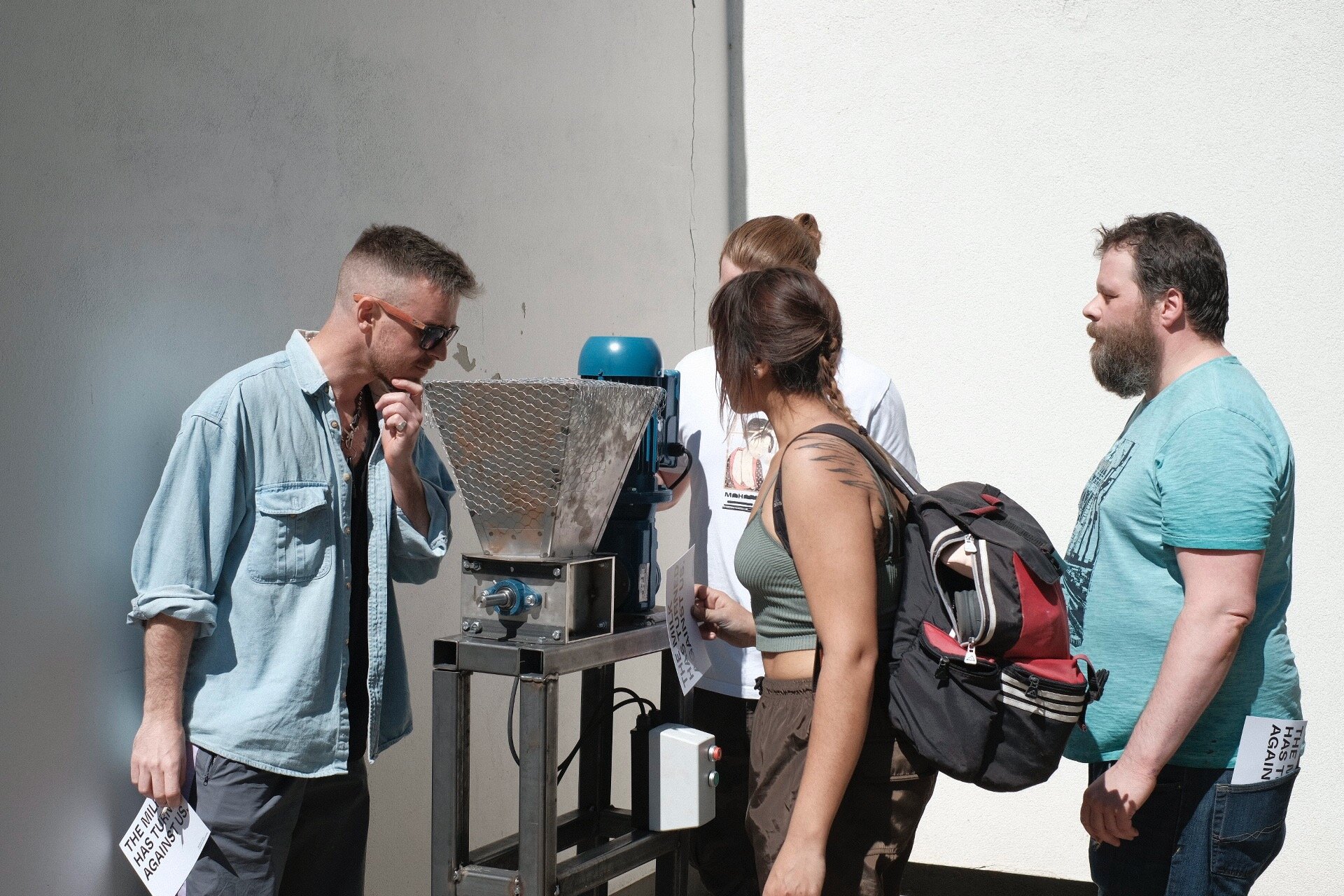 Onlookers observing the shredding process.
