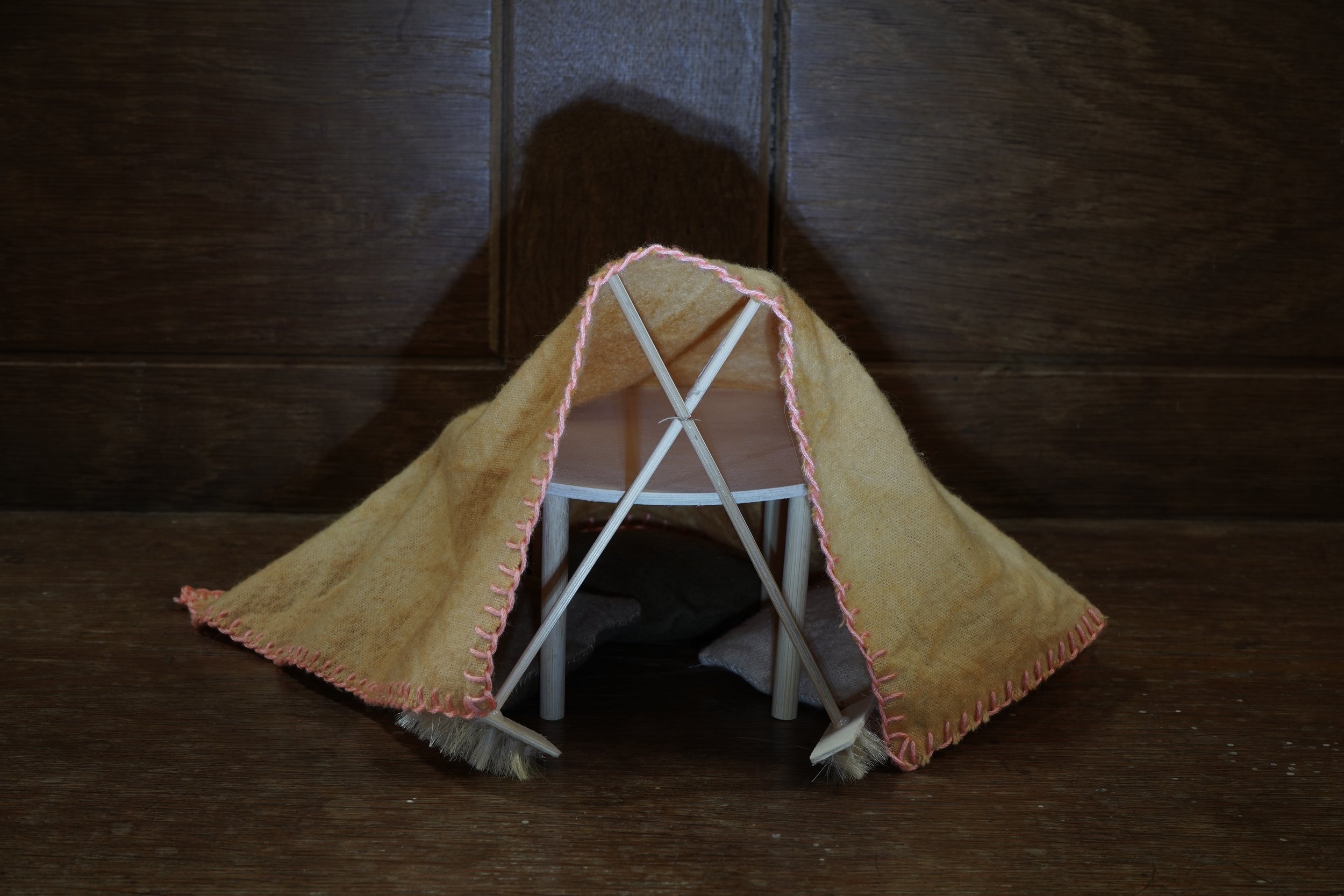   Kitchen table den,  2024, organic brushed cotton dyed with onion skin, onion skin and iron, and avocado stones, balsa wood, dowel and human hair, 18 x 24 x 24cm HxWxD 