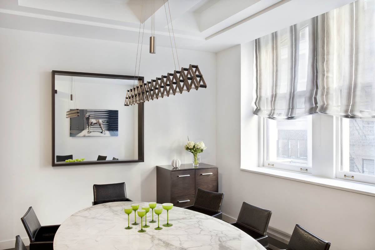 New dining area seating and window coverings complement the existing architectural elements.