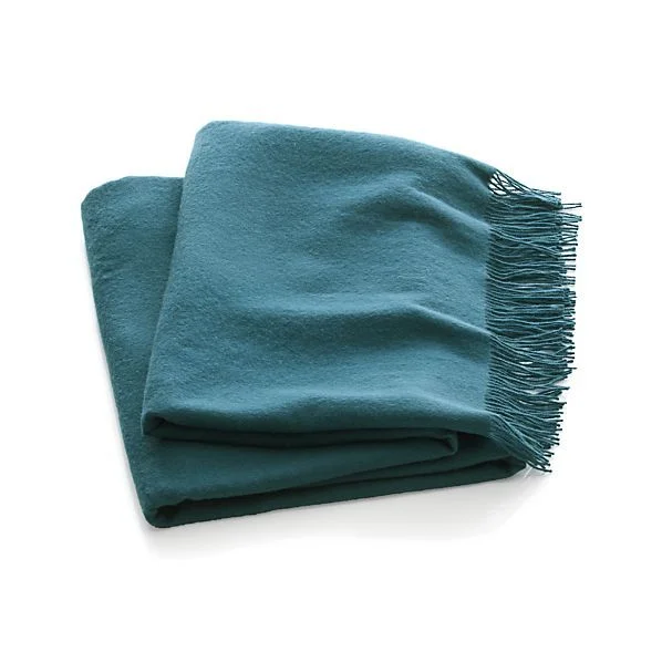 Available in a smaller selection of hues, but very accessible in price, Crate and Barrel’s Lima throws are made in Peru. via crateandbarrel.com