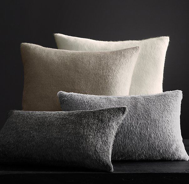 Restoration Hardware keeps their alpaca pillow covers shaggy but short, neutral and undyed, blended with a small amount of sheep wool. via restorationhardware.com