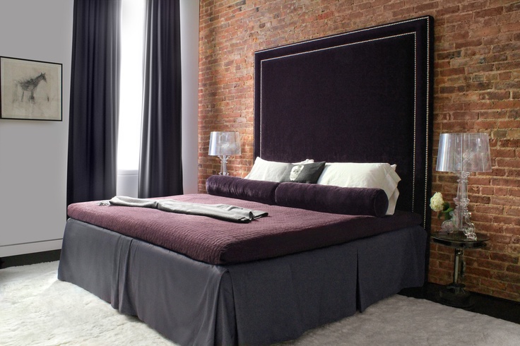 I used a deep, alpaca rug in my client’s master bedroom as a soft and sexy contrast to the plush eggplant velvet headboard. via tamarahubinskyinteriors.com