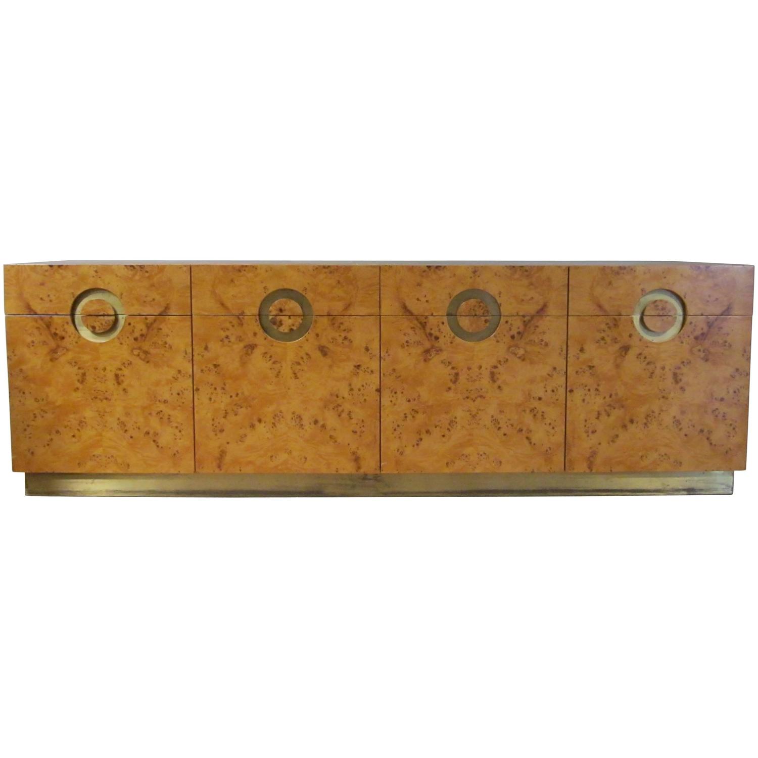 Designed by Willy Rizzo in the 1970s, a four door credenza with burl birchwood and brass accents.