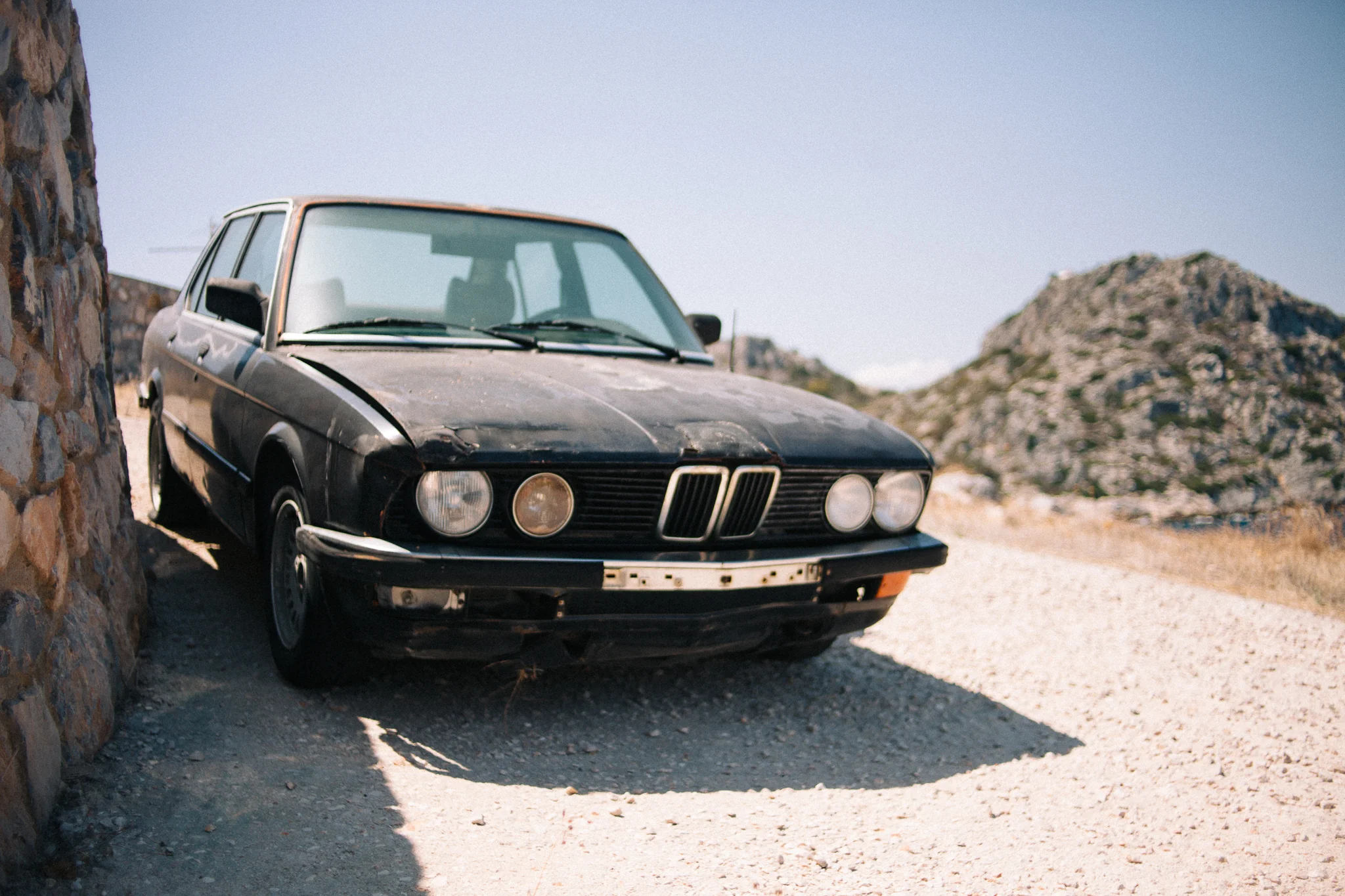 This BMW E12 (5-series) is probably not going to go anywhere either. I'm guessing this is kept for parts for another BMW E12 parked near it which was in really nice condition.