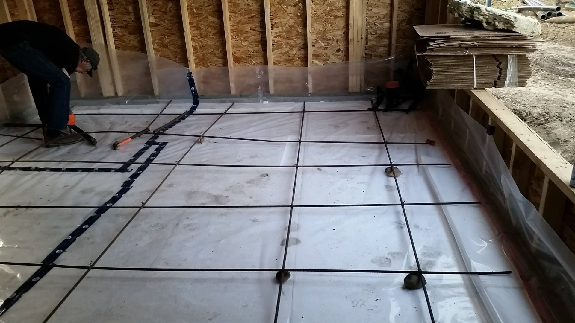 Setting up the rebar for the slab pour overtop the EPS, vapour barrier & radon mitigation system. 