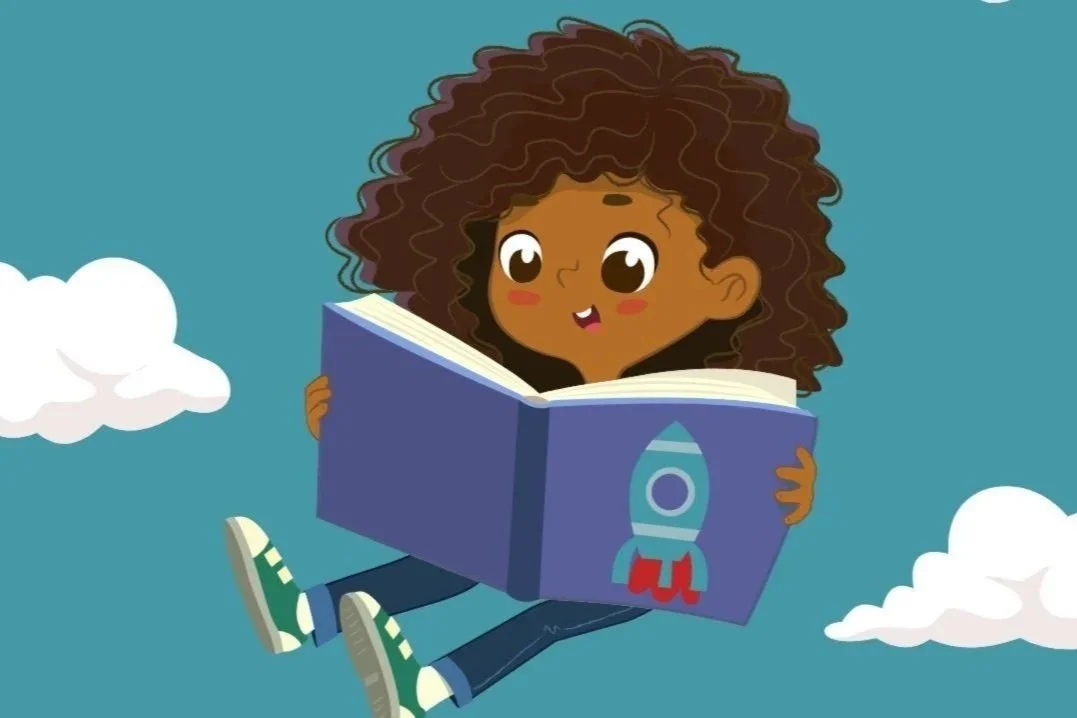 child reading a book in the clouds