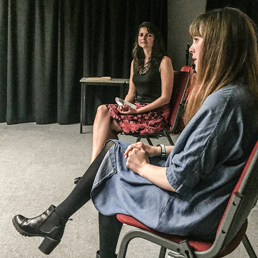 Exposition Space artist Jessica Akerman (foreground) and guest curator Dr. Irene Noy onstage during the private view artist talk for her exhibition, July 2016.