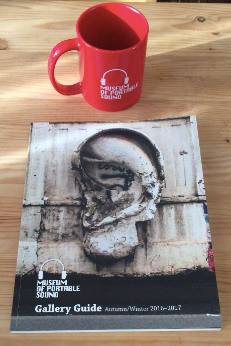 The Museum's official mug and the first edition of its Gallery Guide book