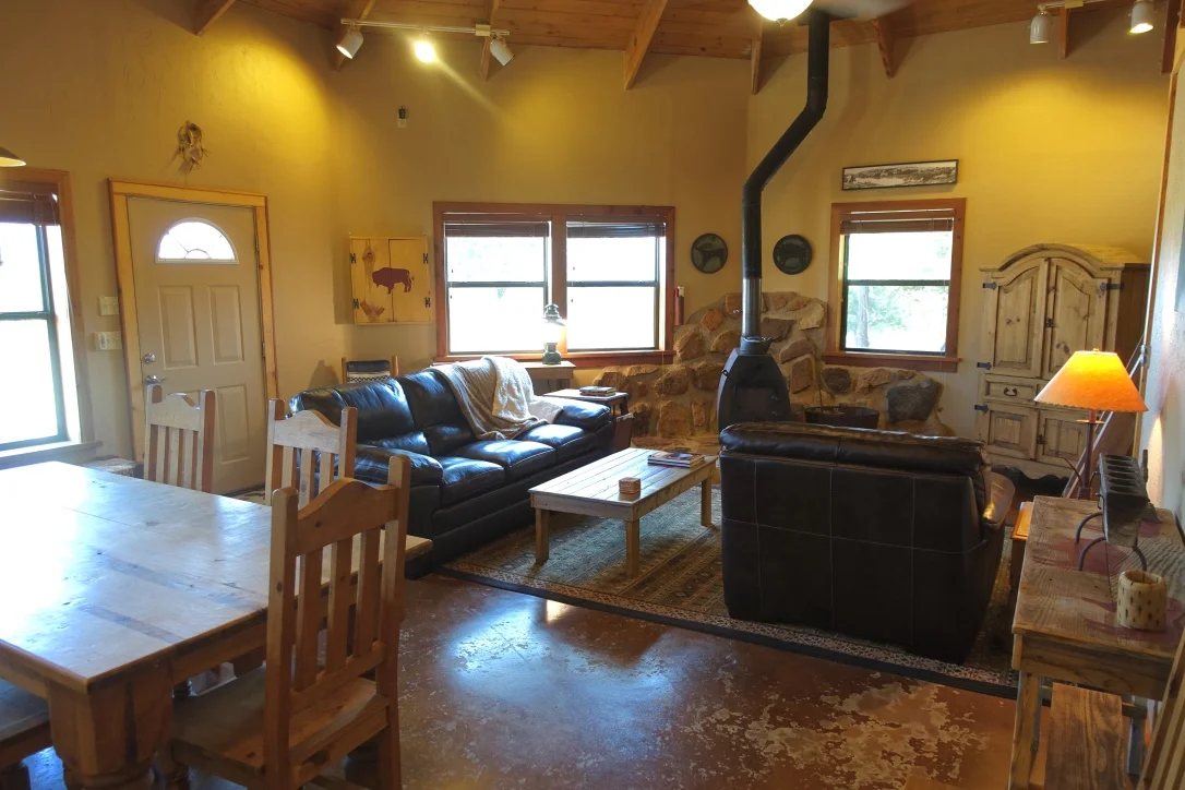 Living Room with super comfy leather sofa, chair and ottoman