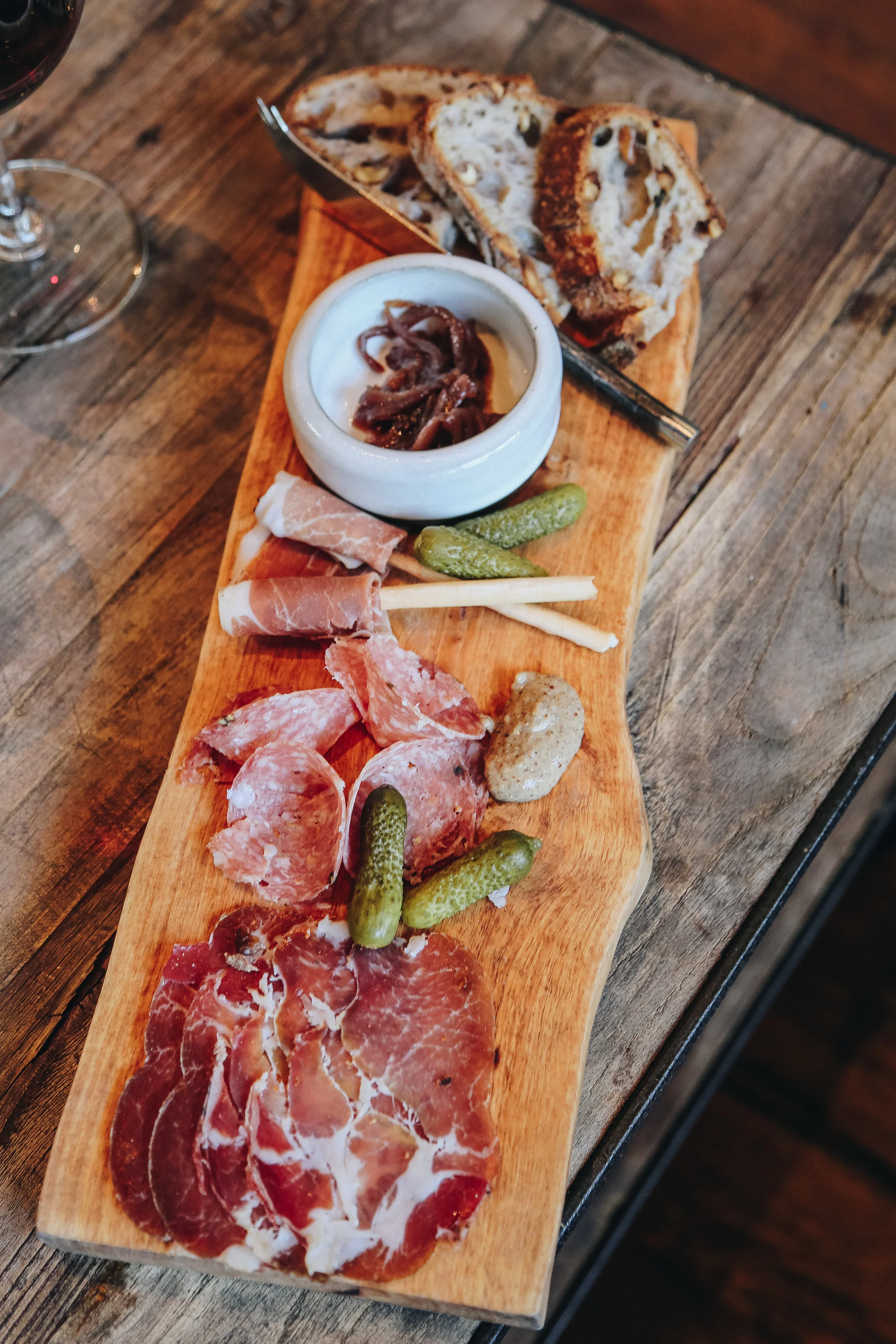 Red & Charcuterie Flight - Zoe’s Dry Cured Coppa, Finocchiona & Prosciutto Wrapped Breadstick, Mustard, Girl & the Fig Red Onion Confit, Cornichon, Model Bakery Walnut Bread Wine Pairings - 2014 Pinot Noir, Charles Vineyard* | 2013 Zinfandel | 2013 Cabernet Sauvignon