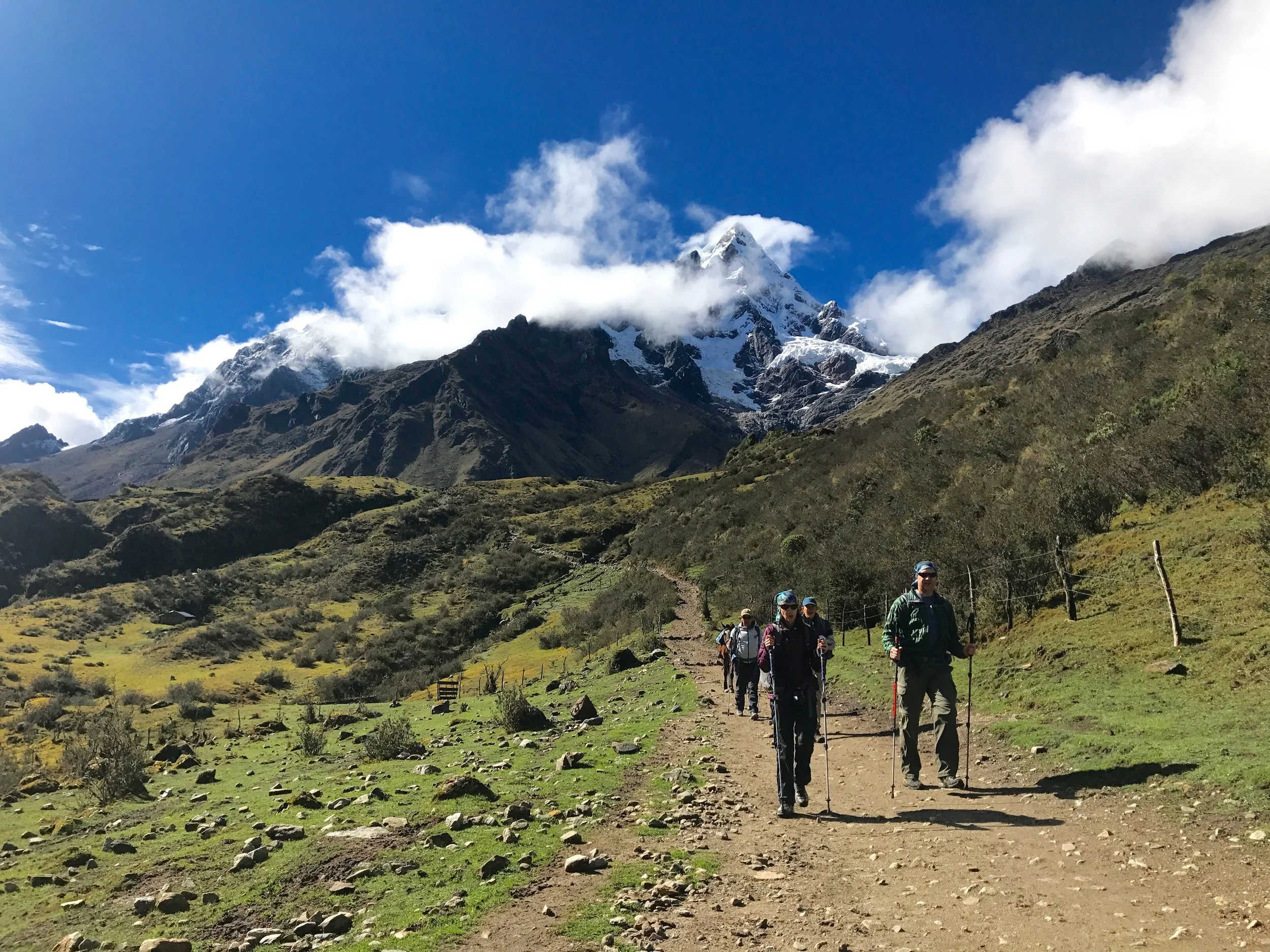 Travelers hiking down from the peak, Salkantay Trek, Peru 2017