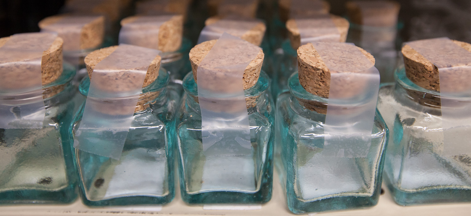 tiny-glass-bottles-display-mana-foods-maui.jpg