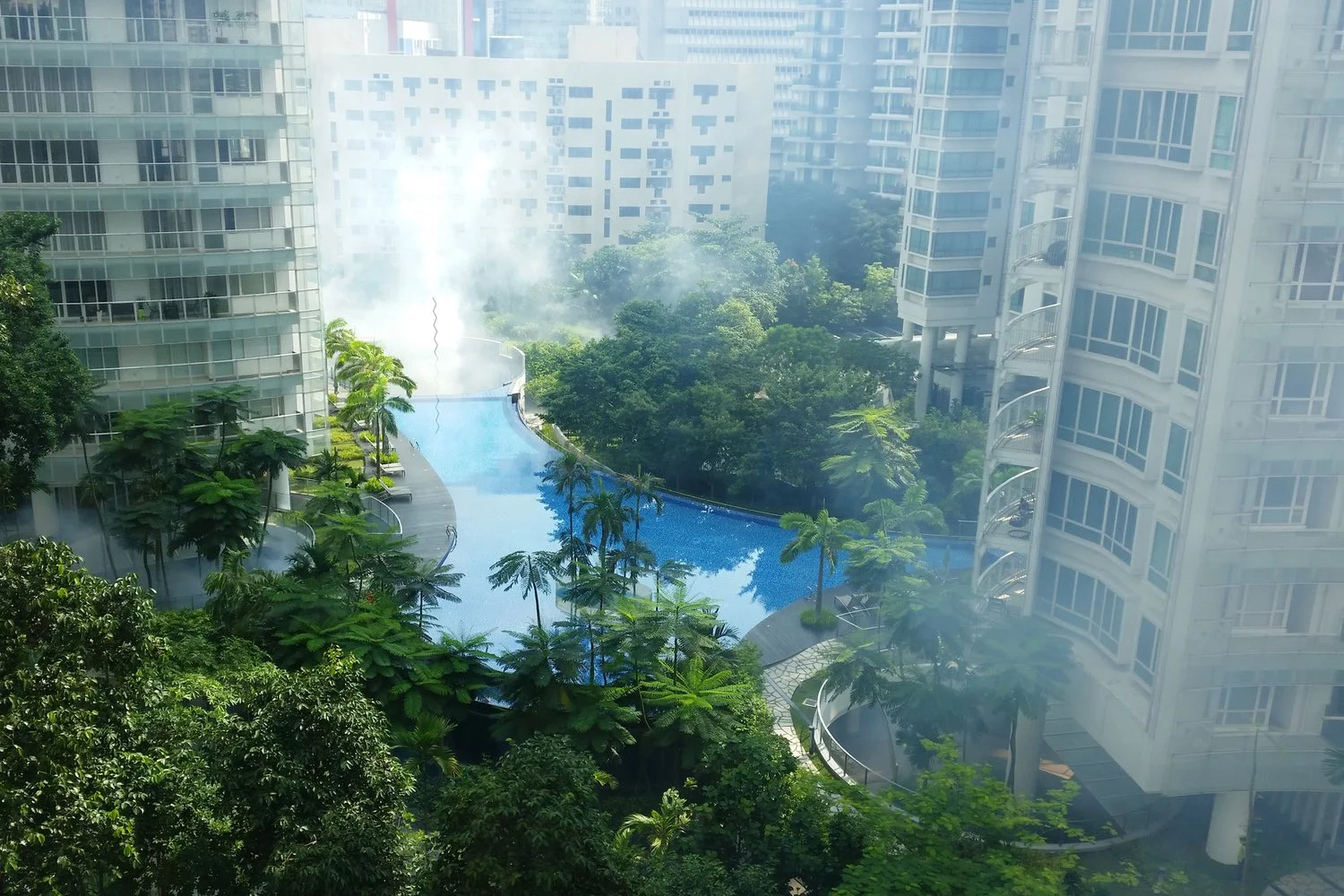 The condo opposite my apartment getting it's weekly fogging for mosquitoes.