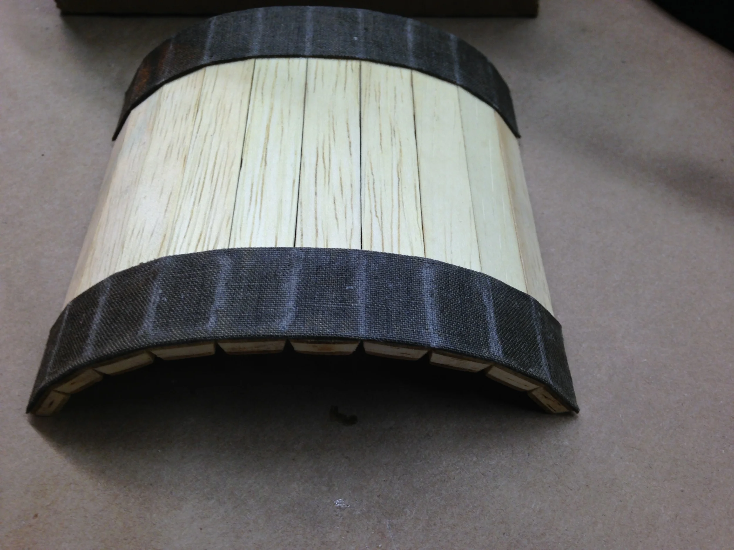 glued cloth bands give stiffness + stretch