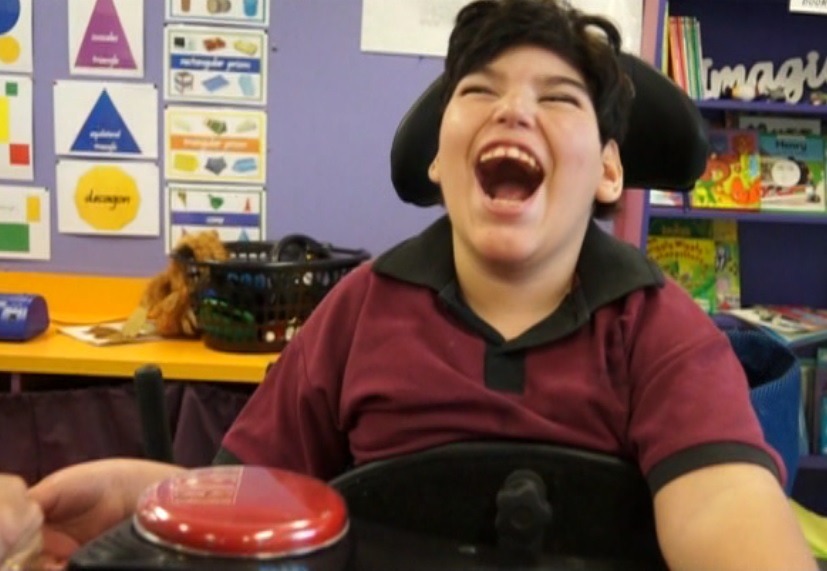 Blake enjoying using a communication device