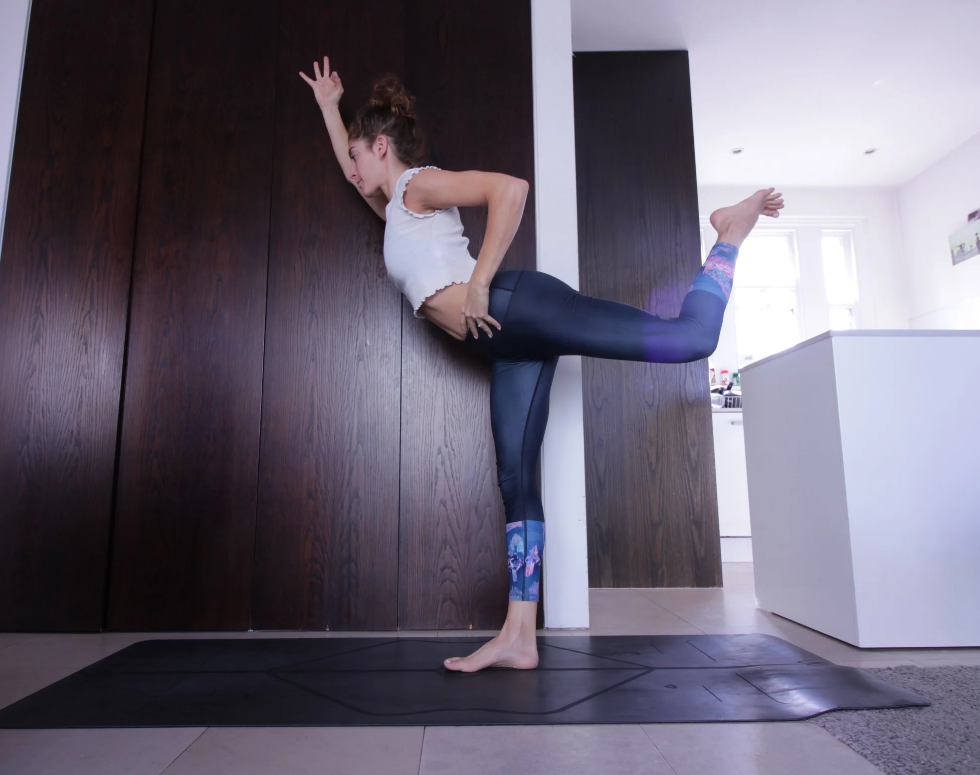 I got this idea from Jason Crandell when he was interviewed on Yoga Land podcast. - As if you were setting up for dancer pose, balance on one leg and bring the opposite heal to the bottom - Extend the opposite hand in front of you and place the other hand on the hip - Lift the back leg as high as you can and start to reach the opposite hand forward - Lift up through the abdominals to help with balance but most importantly bring your focus to the hamstring engagement of the back leg 