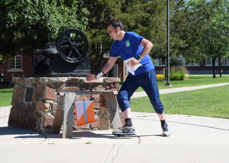 CROC's Dan Grabski punching a control on the sprint course.