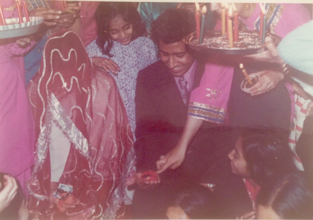 Mehndi: henna ceremony. Draped in a veil.