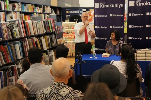 John Fuller, Kinokuniya, welcomes the audience