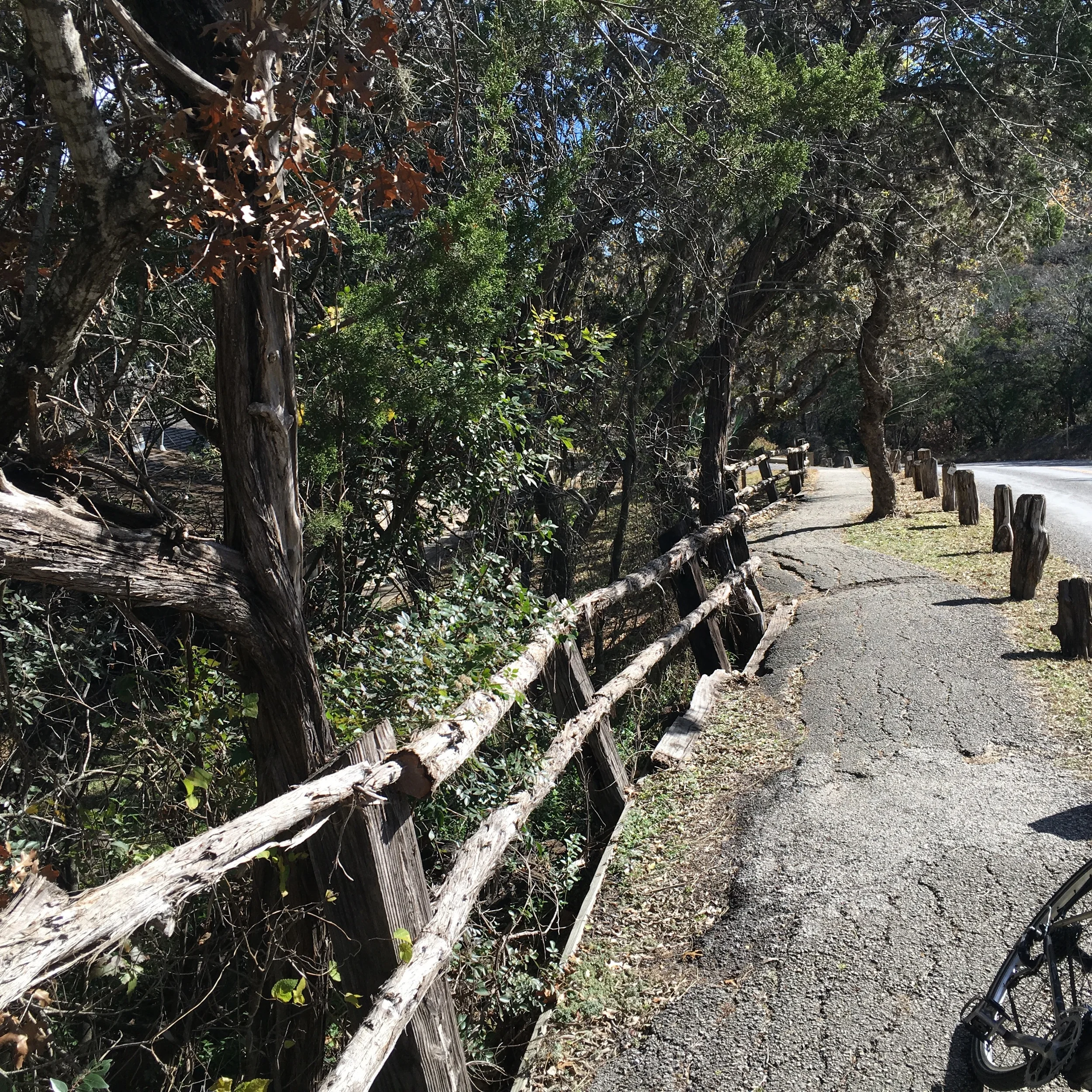 A rustic fence along the river road.